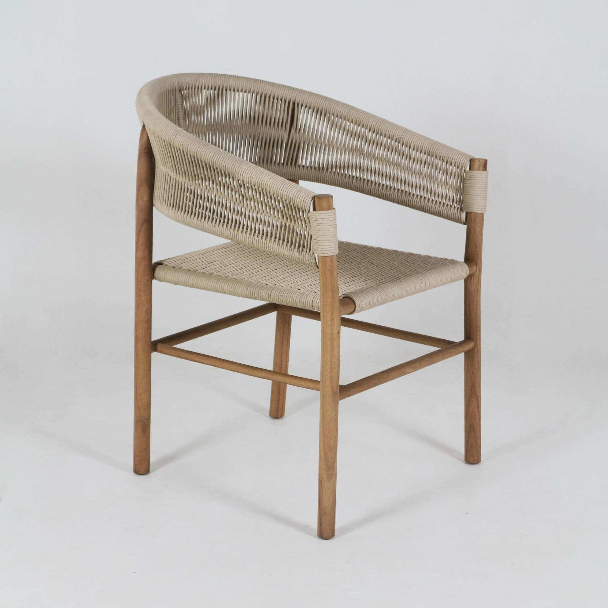 Teak-framed dining chair with beige polypropylene rope-woven seat and curved wraparound backrest, integrated arms and tapered solid-wood legs with stretcher, photographed on a neutral background.