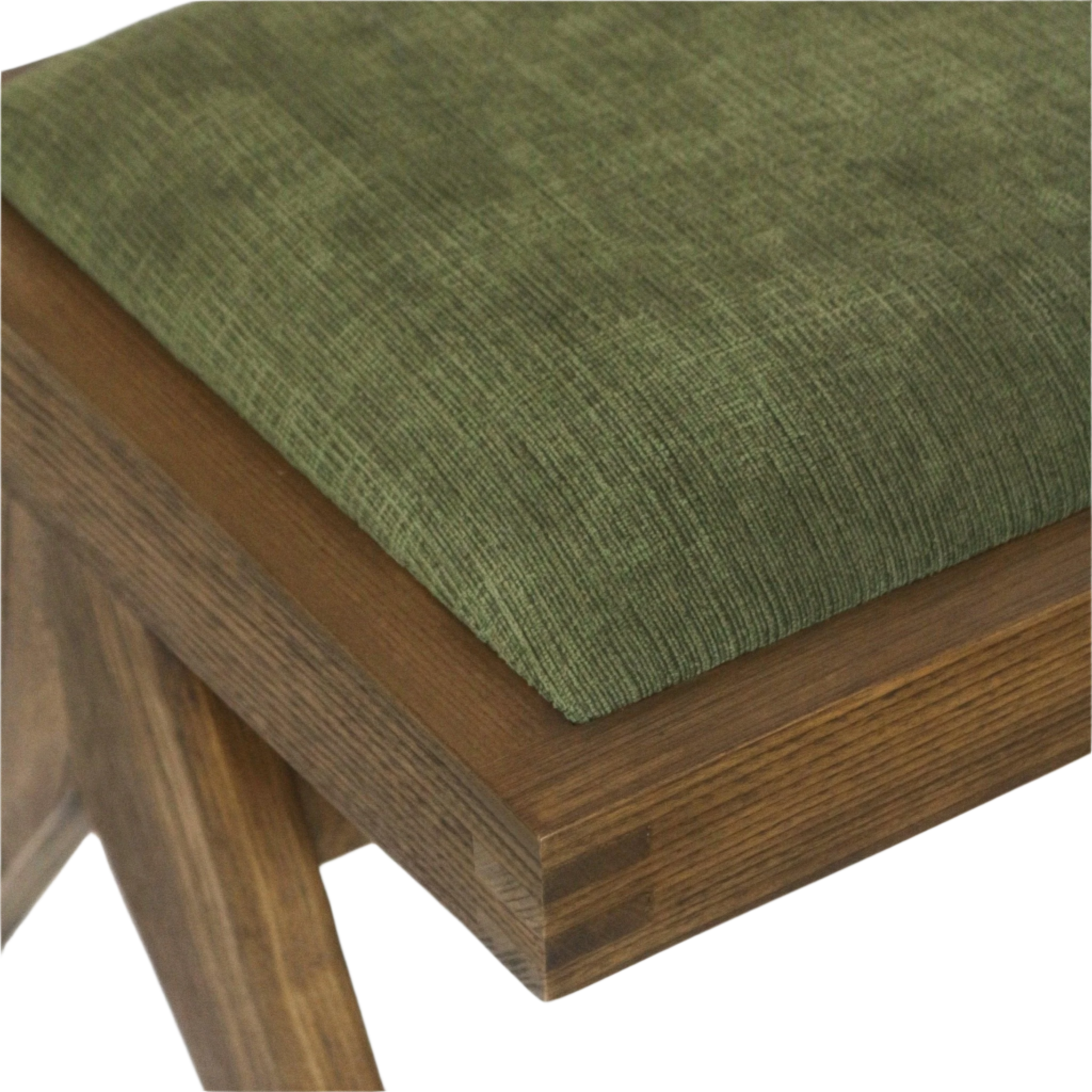 Close-up of a green chenille upholstered seat cushion resting on a medium-brown solid ash wood frame of a mid-century modern armless side chair, highlighting the textured fabric and corner joinery detail.