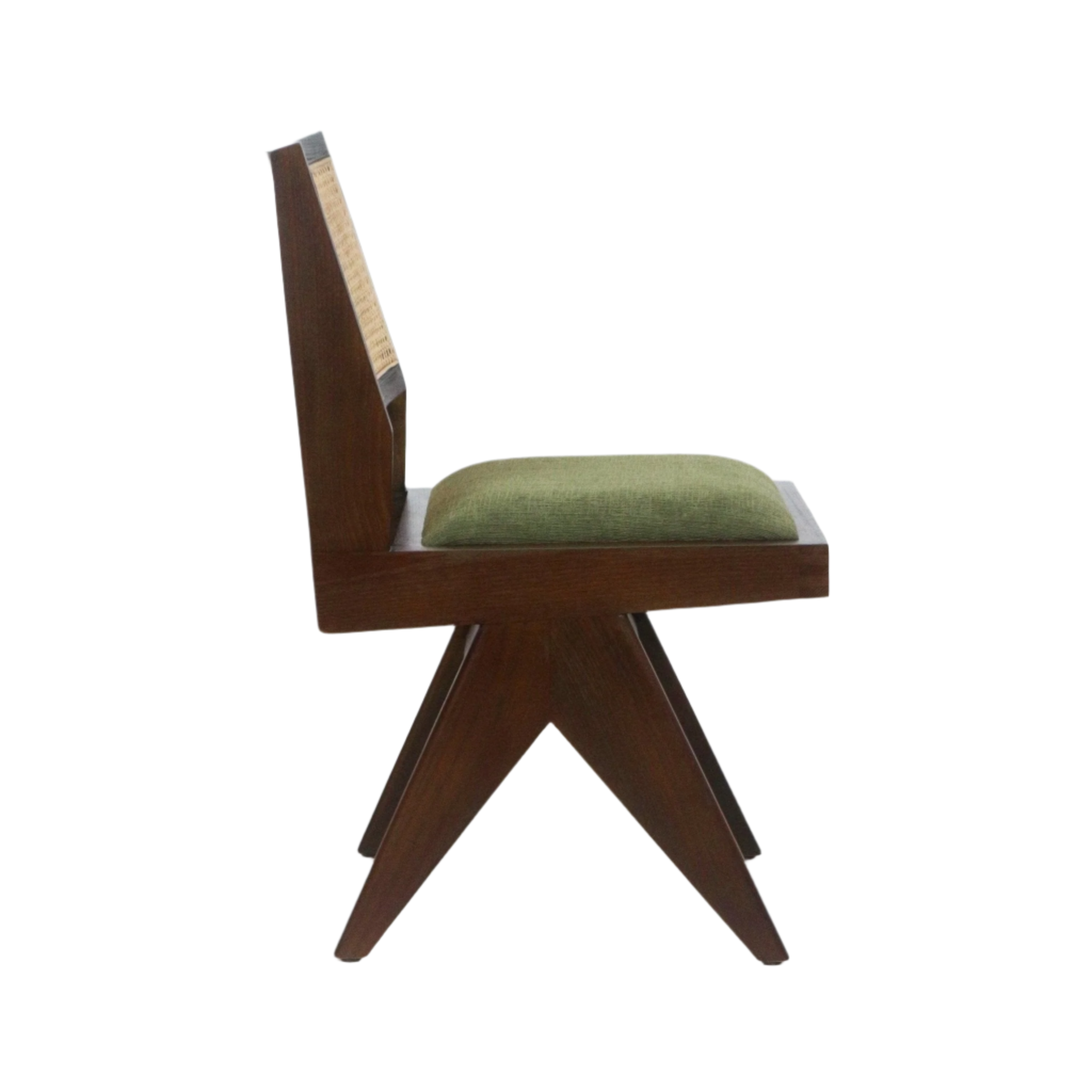 Side profile of a mid-century armless dining chair with a solid dark wood frame, woven cane back panel, splayed X-shaped legs and a low green fabric-upholstered seat cushion on a white background.