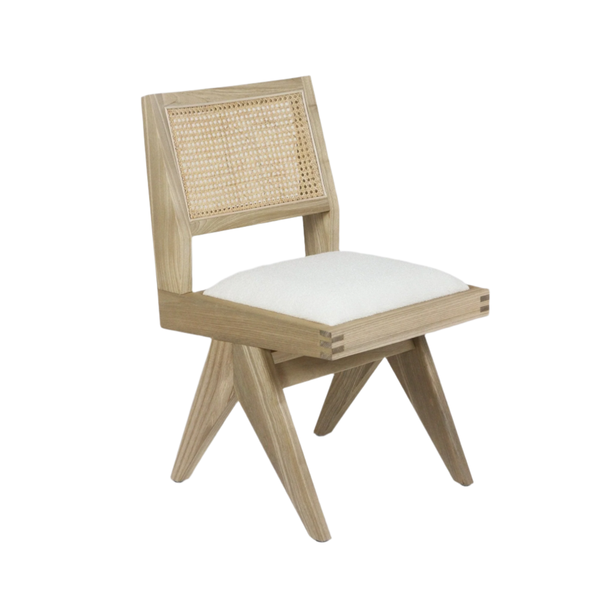 Armless Jeanneret-style side chair in natural ash wood with a woven cane back and cream bouclé upholstered seat, angled mid-century legs and visible corner joinery.