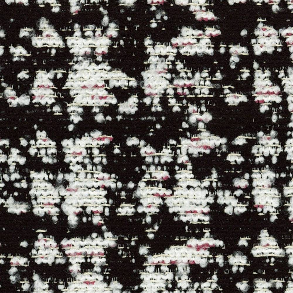 Close-up of black woven upholstery fabric showing dense white boucle clusters with subtle pink slubs on a textured 41% viscose, 9% acrylic, 50% polyester blend, suited for contemporary sofas.