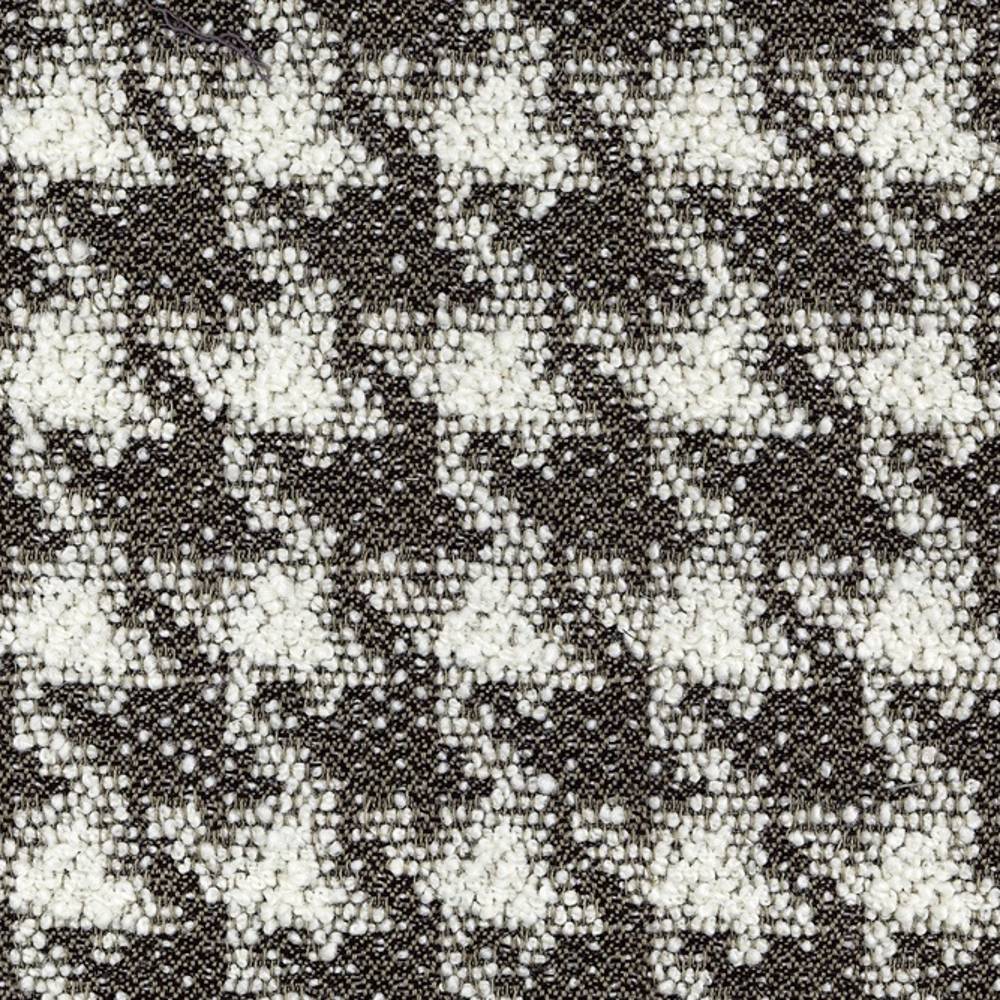 Close-up of black-and-white boucle upholstery fabric showing a textured small-scale houndstooth pattern with looped yarns and woven base; 25% wool, 44% acrylic, 21% cotton, 10% polyester blend.