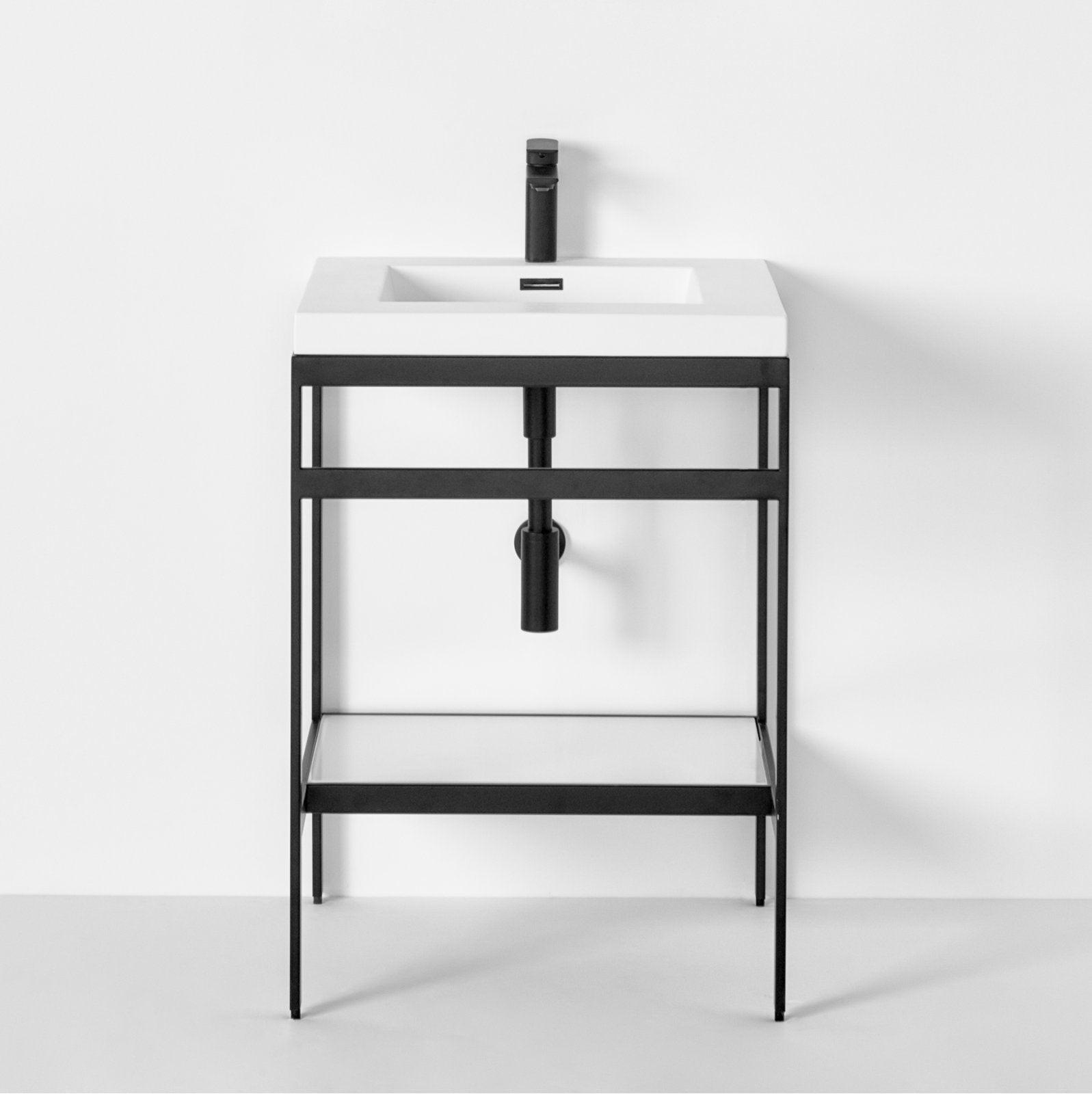Modern freestanding 24.25 in. single-sink bathroom vanity with a white stone rectangular top, matte black faucet, open black frame base with exposed plumbing and a lower shelf.
