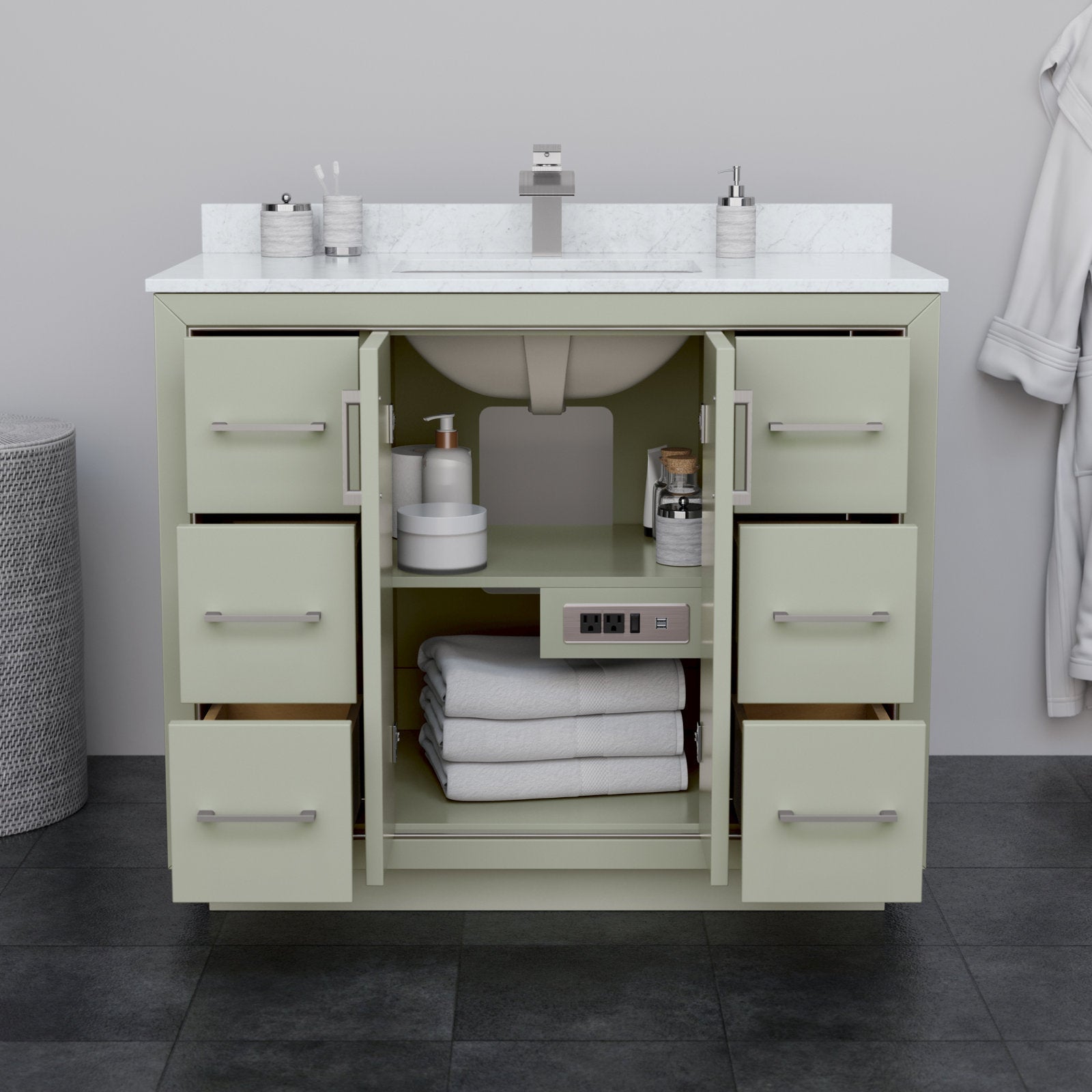 Freestanding 42-inch modern solid wood bathroom vanity in stone with a white stone countertop, undermount ceramic sink, brushed-nickel hardware and open center cabinet showing folded towels, toiletries and a built-in outlet.