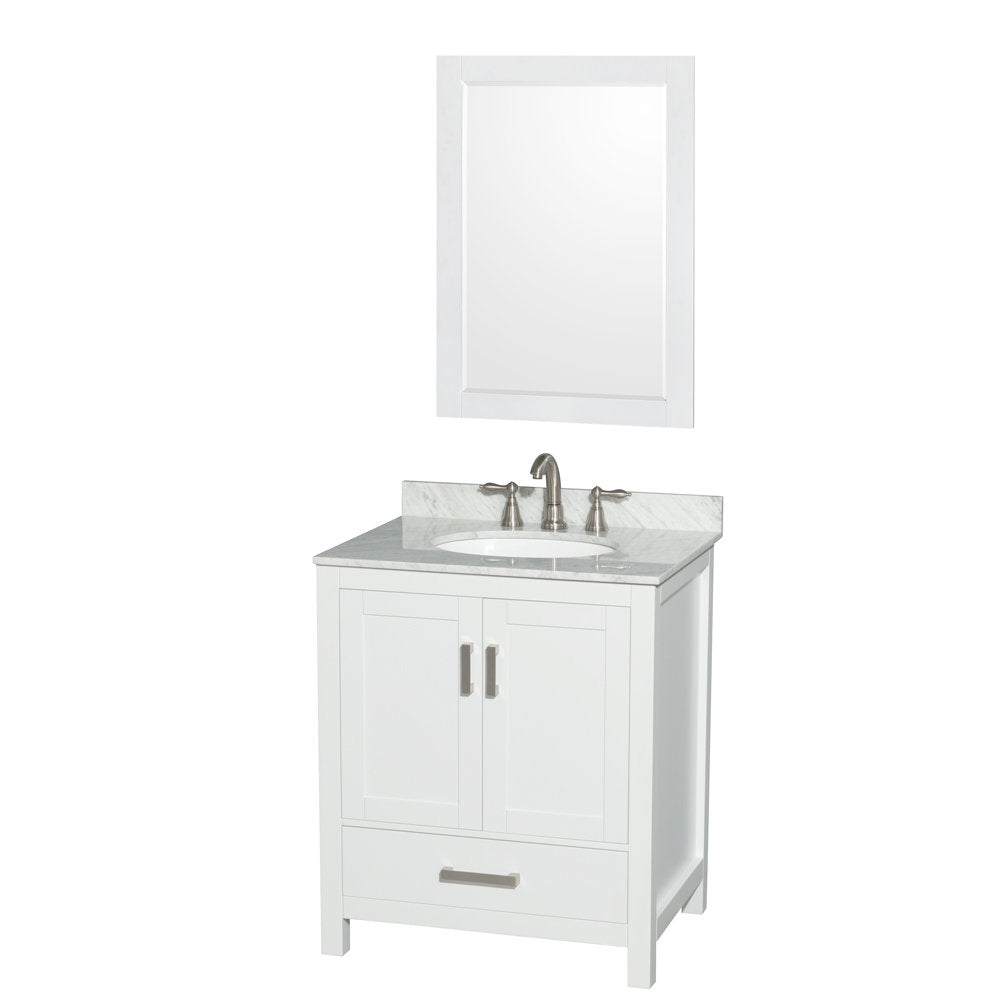 White solid-wood freestanding bathroom vanity with gray stone countertop and backsplash, oval undermount ceramic sink, brushed-nickel faucet and hardware, two-door cabinet with bottom drawer, paired with a white framed mirror.