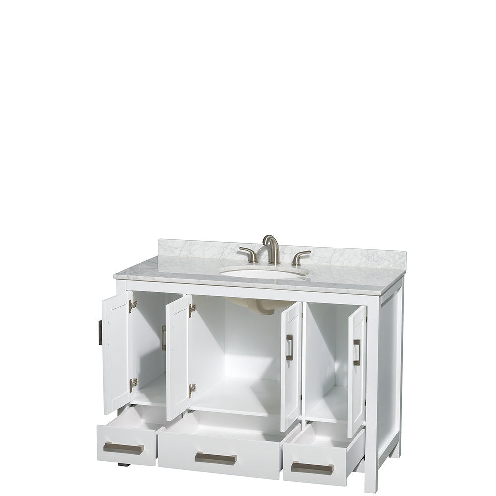 White 48-inch modern vanity with gray-veined marble top and backsplash, undermount ceramic sink, brushed nickel faucet and rectangular drawer pulls, three lower drawers and open cabinet doors revealing interior shelf storage.