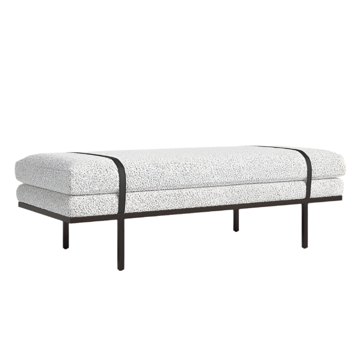 75-inch boucle end-of-bed bench upholstered in natural off-white boucle fabric with two dark accent straps, supported by a slim dark wood base and slender legs in a modern coastal style.