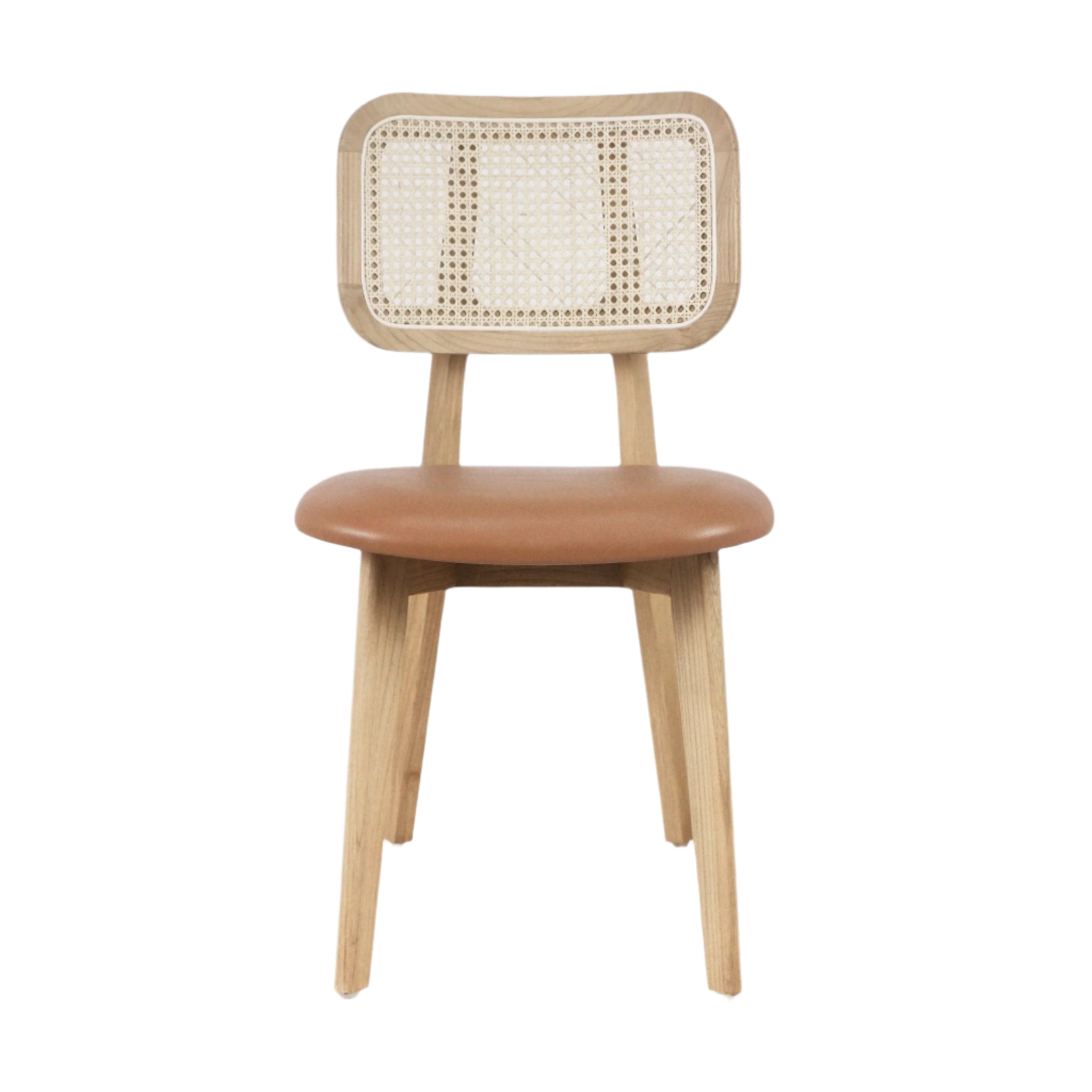 Front-facing armless dining chair with a woven rattan backrest, natural wood frame and tapered legs, and a padded tan leather seat in a boho-modern style on a white background.