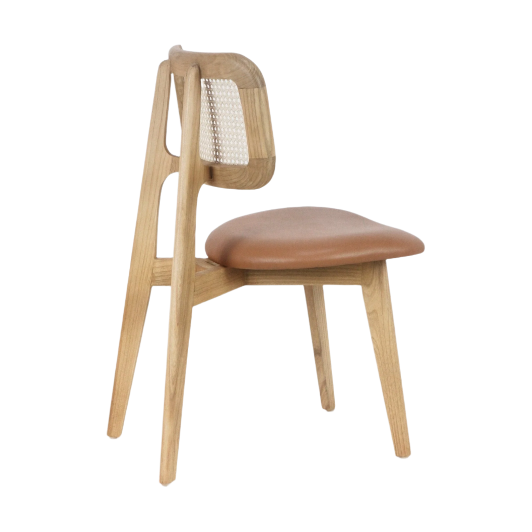 Side view of an armless dining chair with a natural wood frame, woven rattan backrest and a padded tan leather seat on tapered legs.
