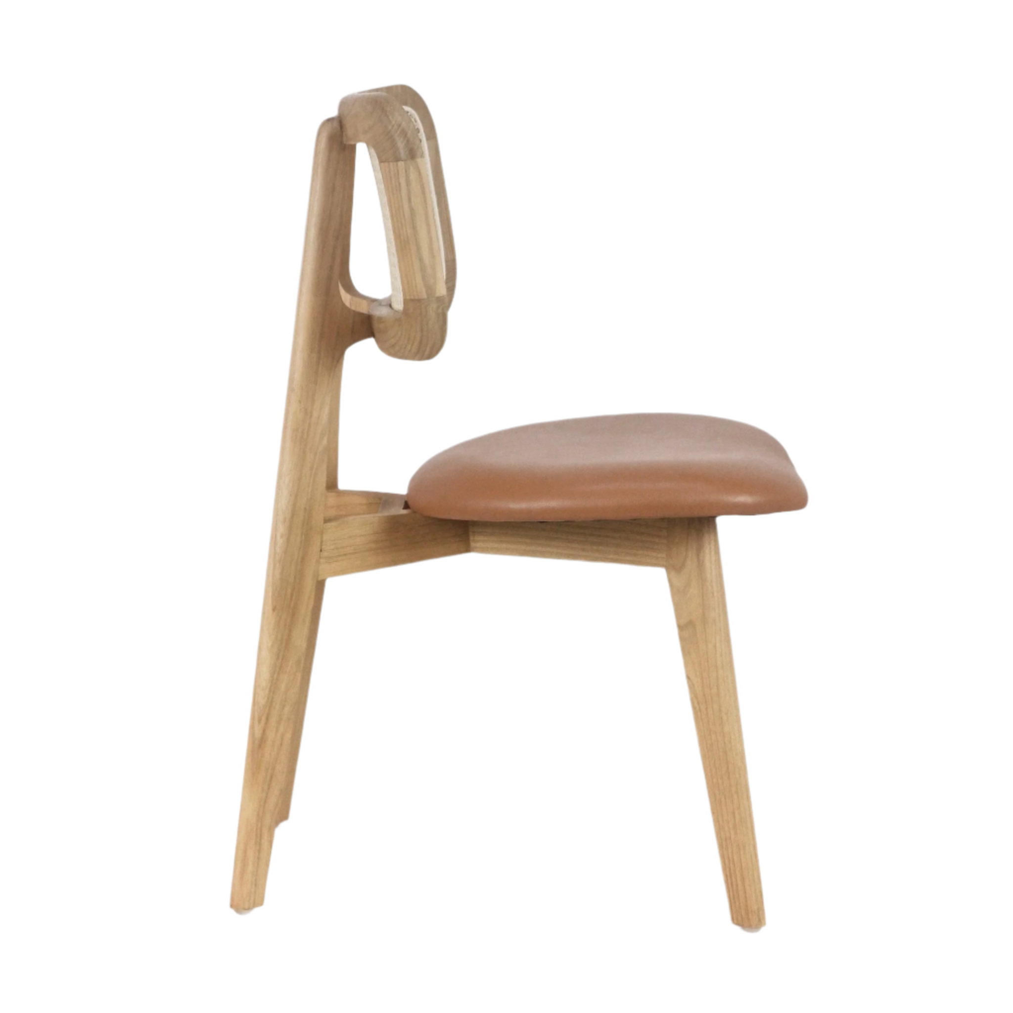 The INTERIORTONIC Abode Dining Chair features a modern minimalist design with a curved rattan backrest, padded tan leather seat, and solid wood frame with angled legs, shown side view against a plain white background.