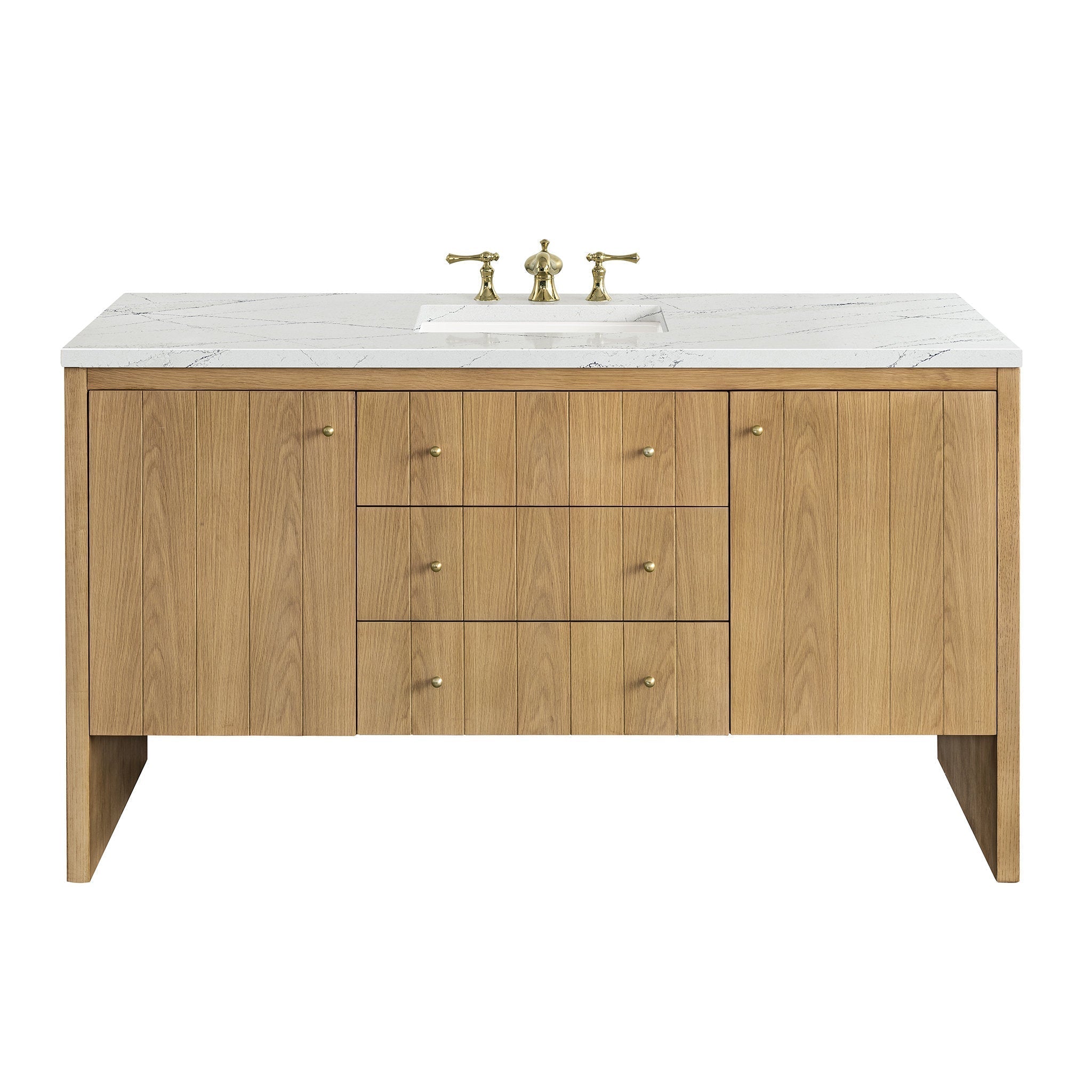 Modern 60-inch single-sink freestanding bathroom vanity in natural oak with a white stone quartz top, rectangular undermount sink, brass widespread faucet, three center drawers and two side cabinets with brass knobs.