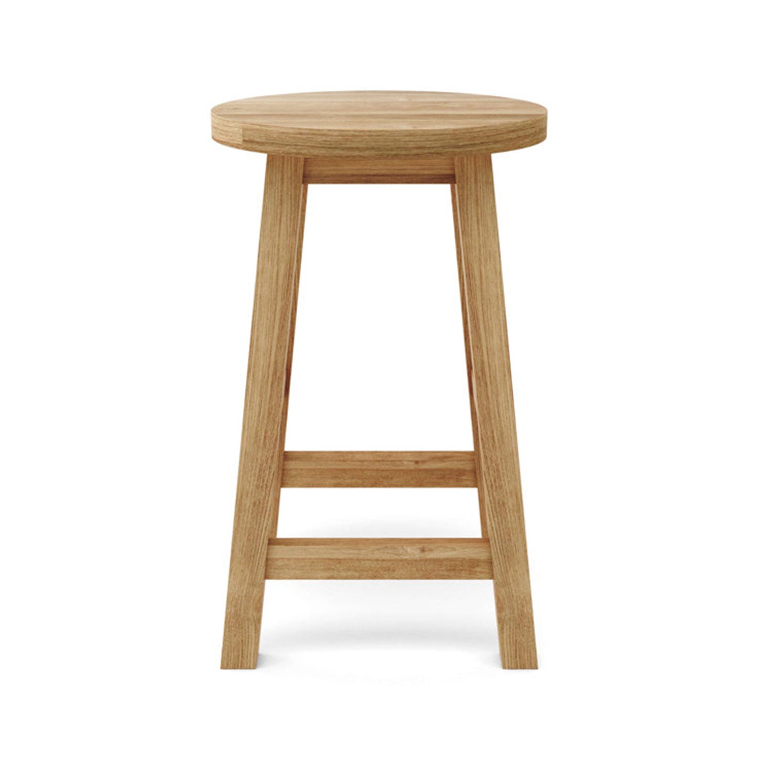 Backless round teak bar stool in a natural finish with tapered legs and two horizontal stretchers serving as a footrest, simple coastal-style solid wood seating suitable for outdoor or kitchen bars.