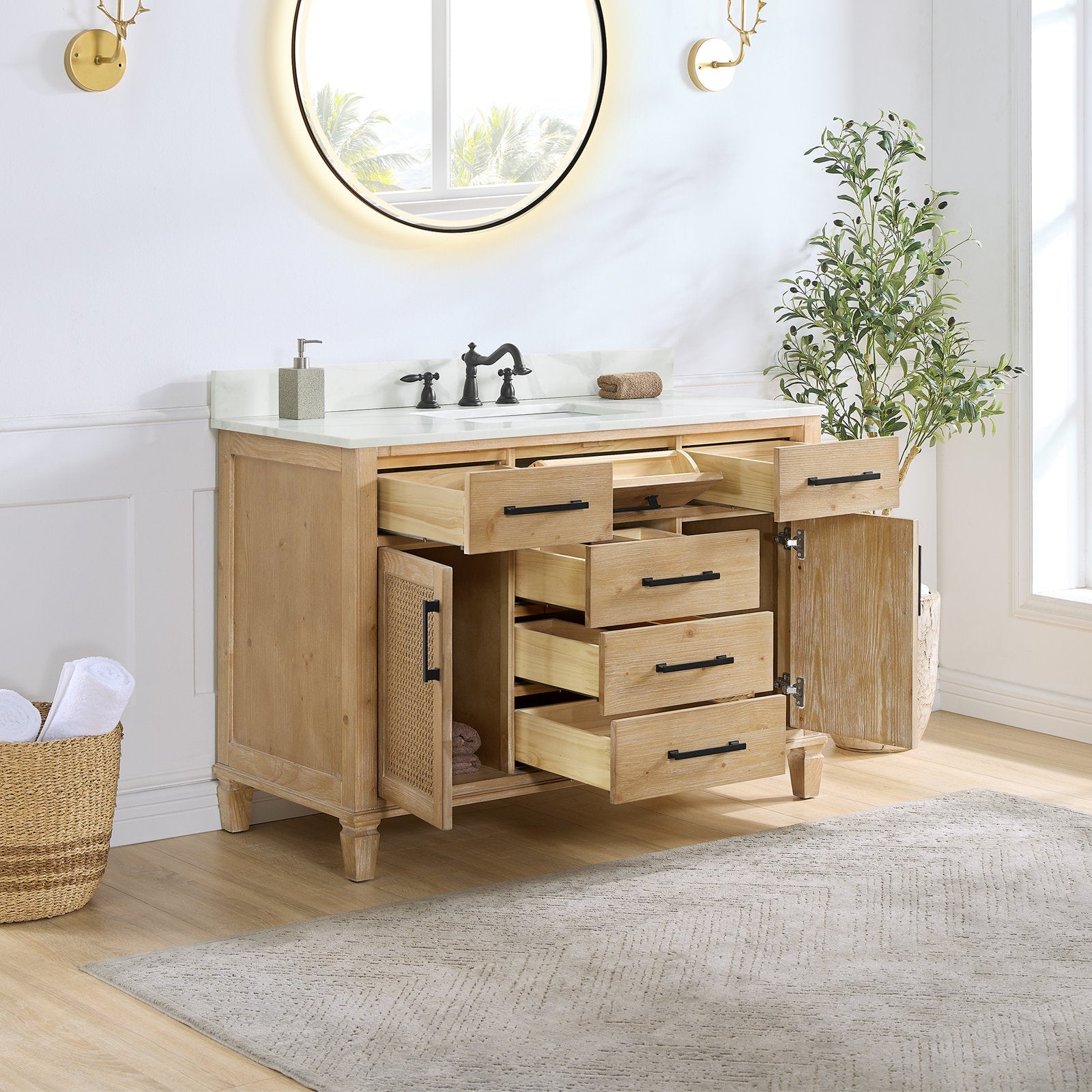48-inch weathered fir single-sink bathroom vanity with Calacatta white quartz top, multiple open wood drawers and cane-front cabinet doors showing interior storage, black bar hardware, white ceramic sink and dark faucet, round mirror above.