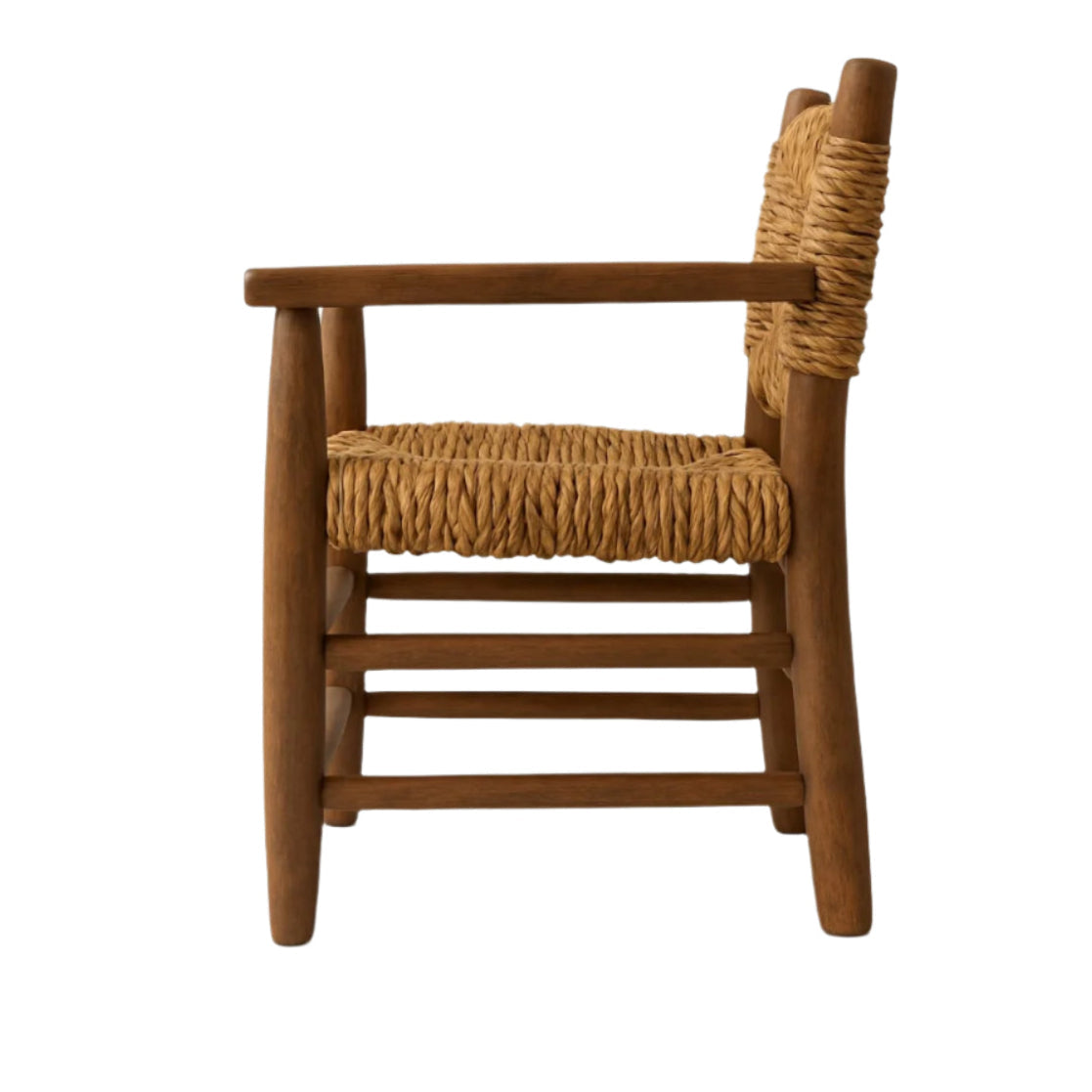 Side view of a rustic solid wood dining chair in warm brown with a woven natural-fiber seat and back, simple wooden armrests, and rounded tapered legs.