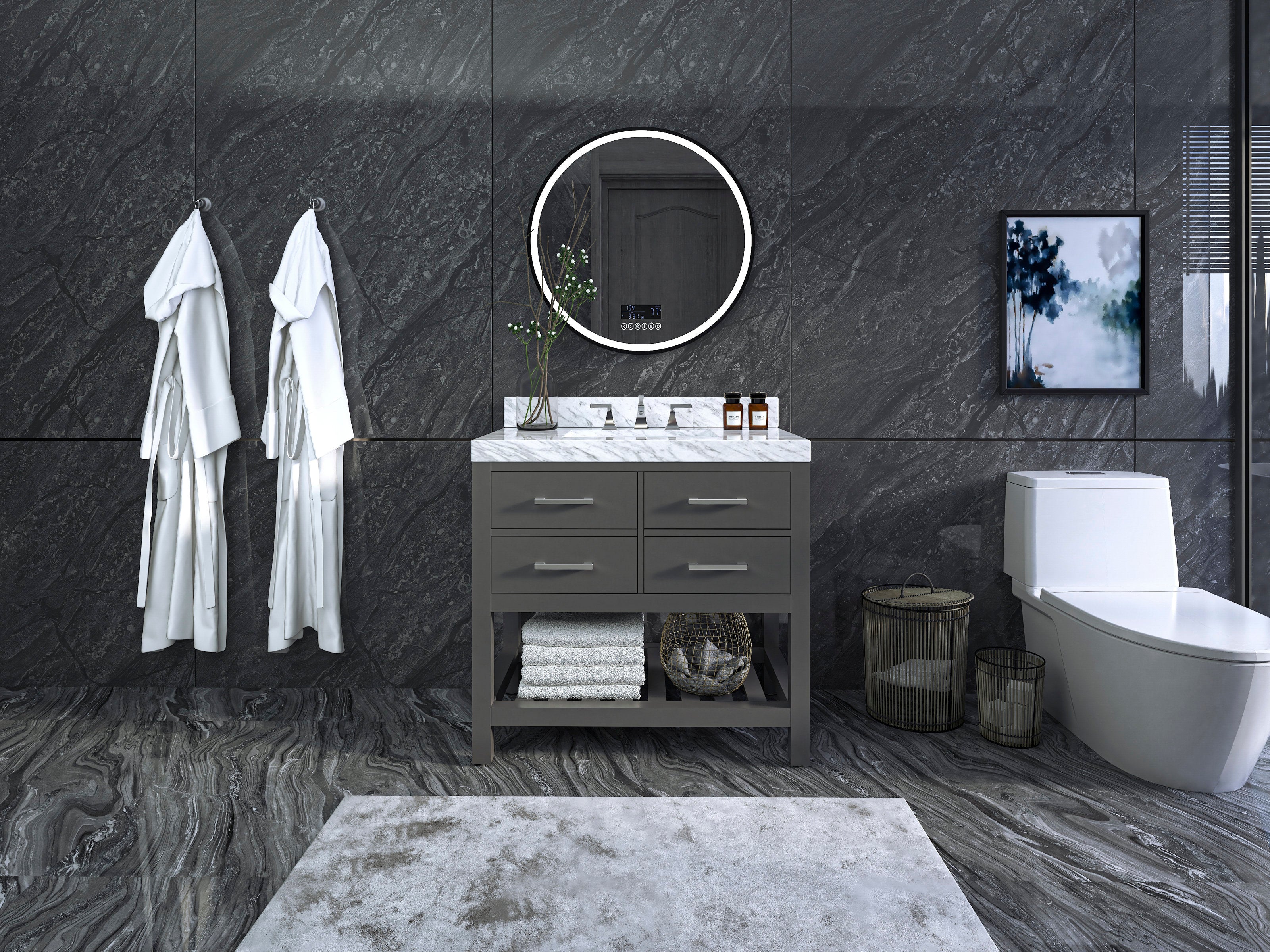 36-inch freestanding modern solid wood vanity in stone gray with a white marble top and single sink, round illuminated mirror above, open lower shelf with folded towels and basket, decorative jars, two white robes on hooks and a toilet at right.