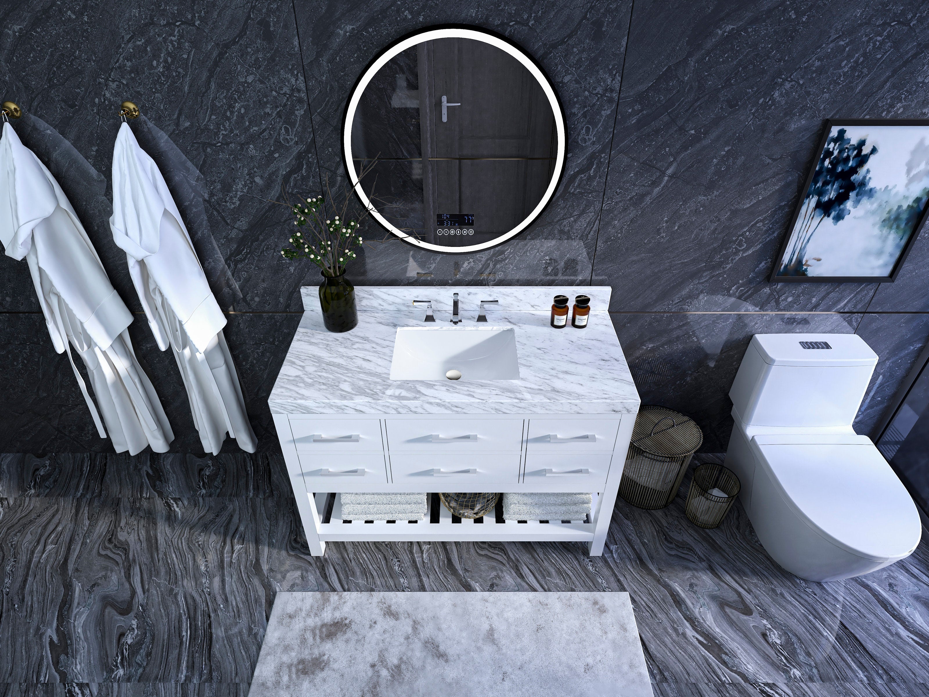 Overhead view of a contemporary white solid wood freestanding single-sink bathroom vanity with a marble stone top, rectangular undermount sink, chrome faucet, six drawers, open lower shelf with towels, round LED mirror and dark stone walls.