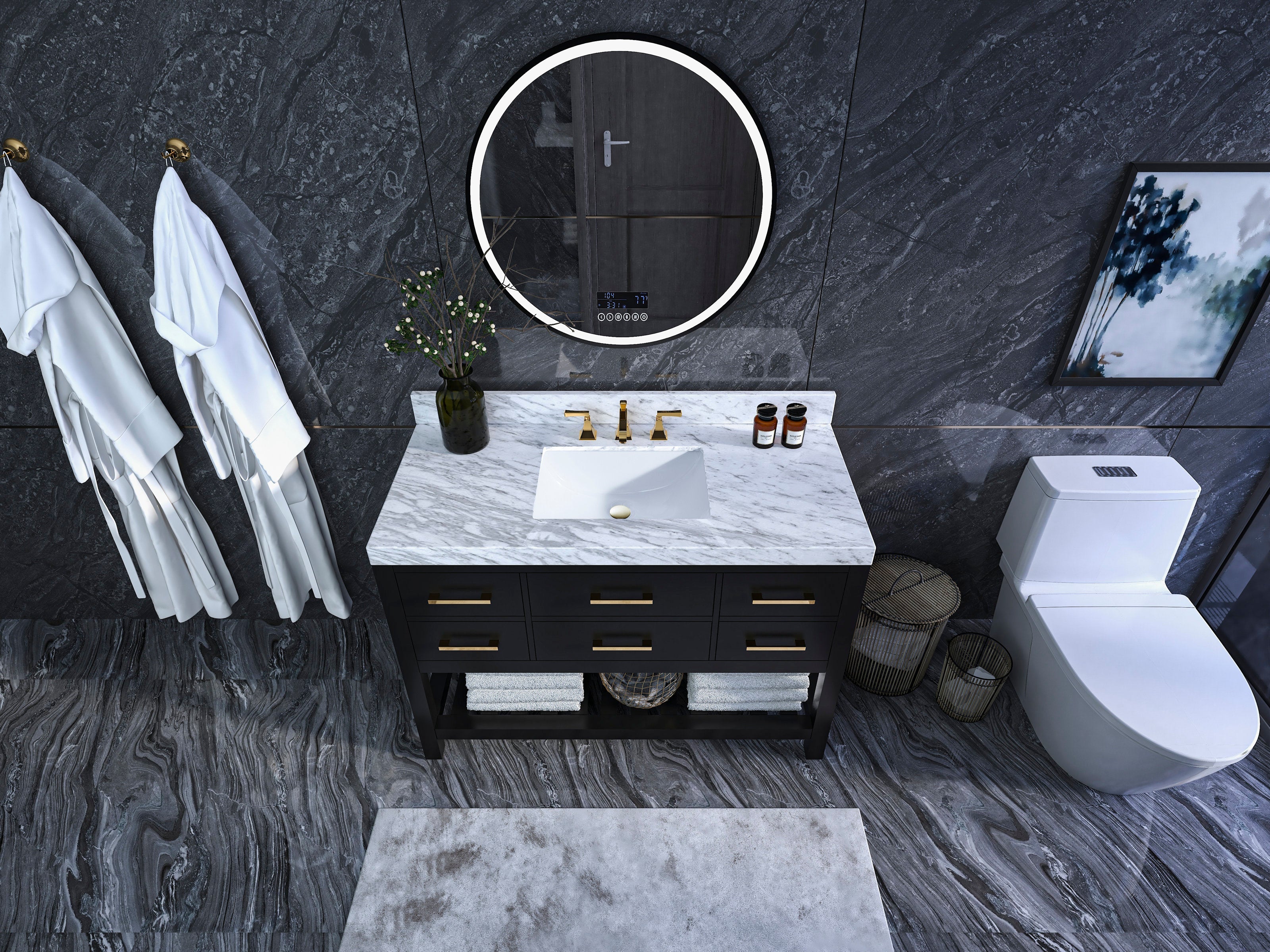 Overhead view of a 48-inch modern black solid-wood vanity with white marble top, integrated ceramic sink, brass faucet and drawer pulls, round LED mirror, dark stone walls, robes and nearby toilet.