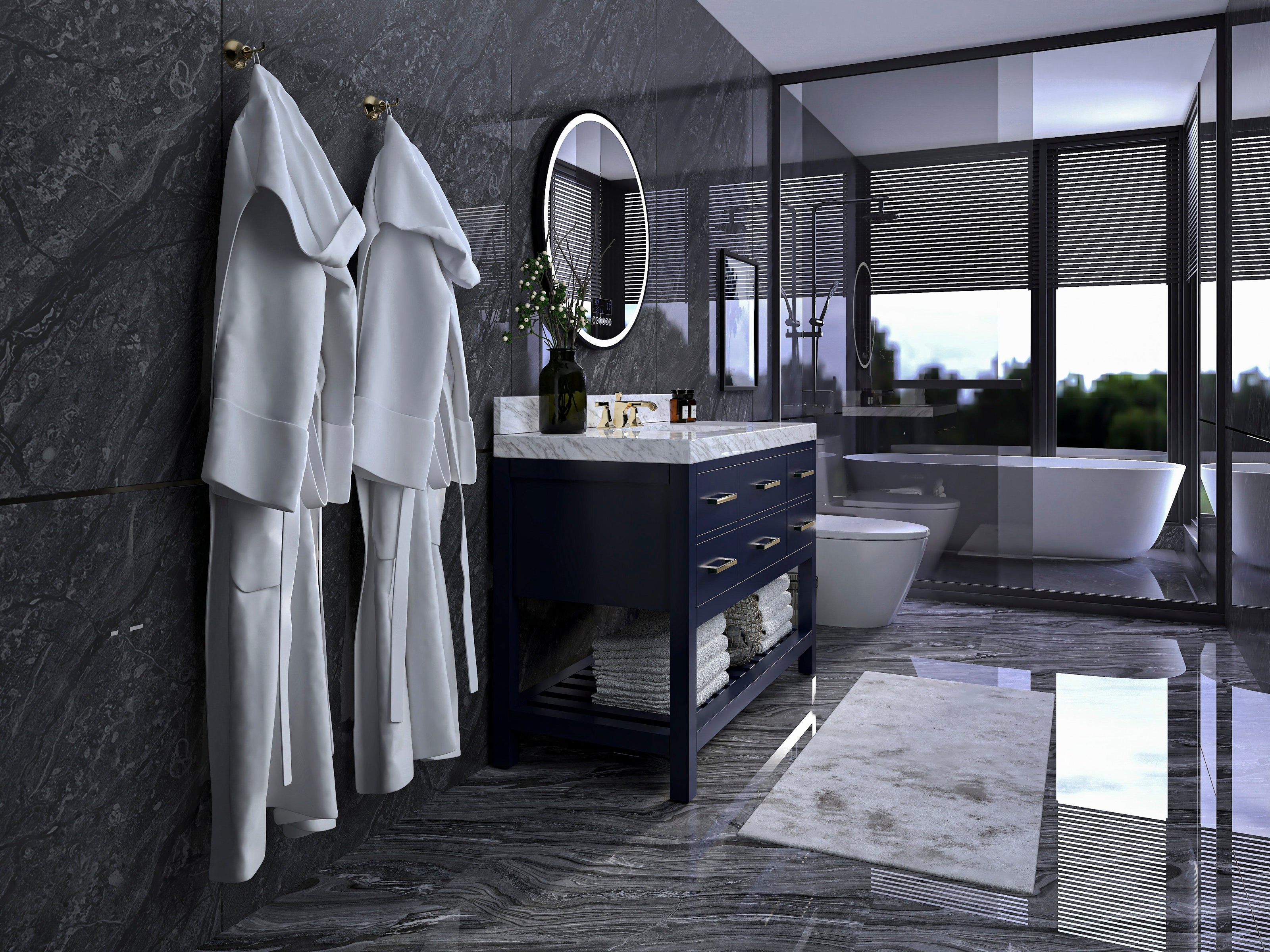 Freestanding modern single-sink vanity in solid wood with a marble stone top and brass hardware, open lower shelf stacked with towels, round mirror above, white robes on brass hooks and a freestanding tub beyond glass.