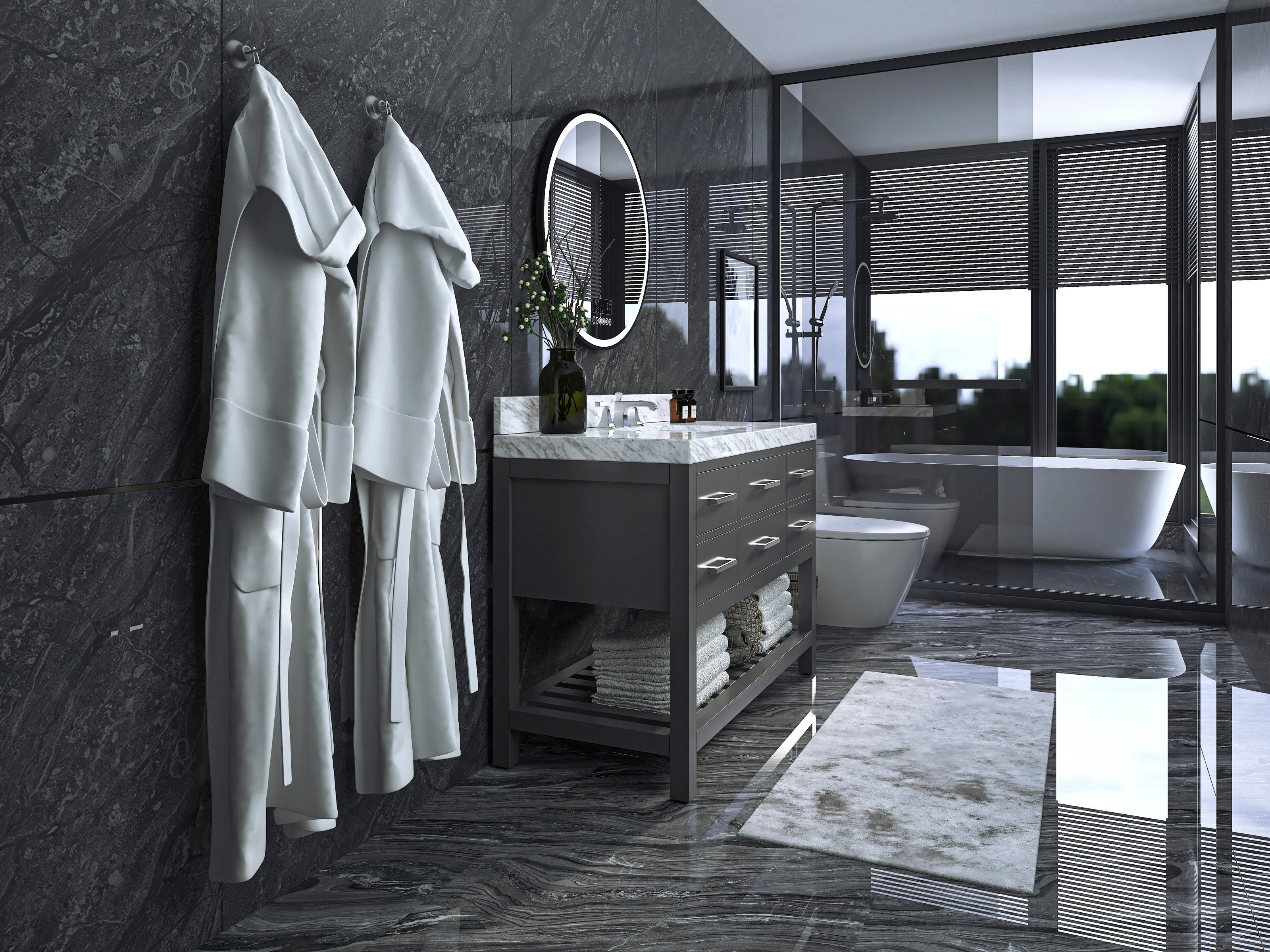 Modern stone-colored solid wood single-sink vanity with a white marble countertop and oval mirror, open lower shelf with folded towels; white bathrobes on wall hooks and glass-enclosed shower with freestanding tub visible.