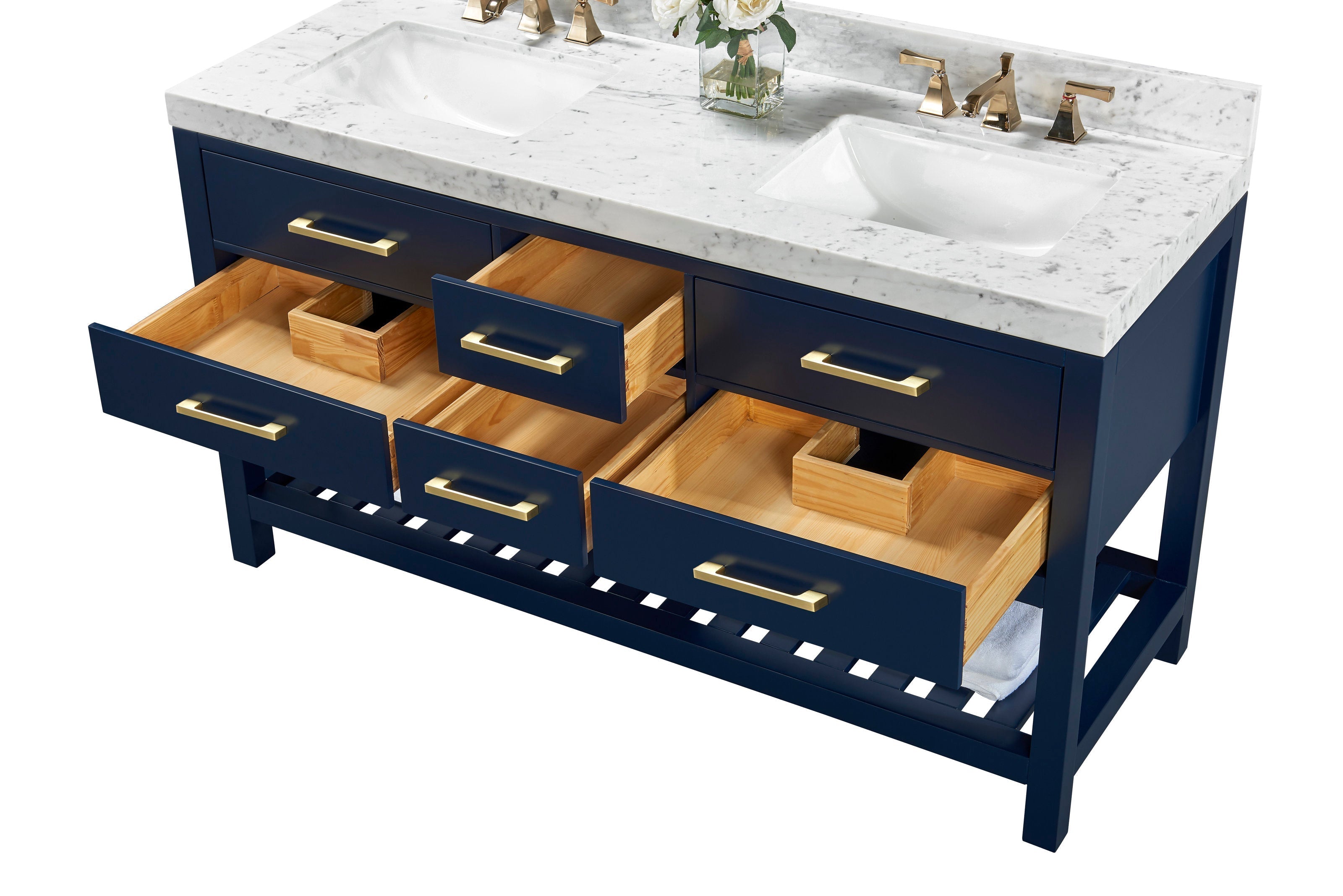 Freestanding modern navy solid-wood bathroom vanity with a white stone marble top, two undermount white ceramic sinks, brushed gold hardware and several open drawers showing natural wood interiors.