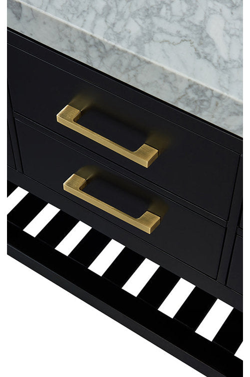 Close-up of a black solid wood bathroom vanity with a veined marble stone countertop, two drawers fitted with brushed brass rectangular handles and a slatted open shelf at the base.