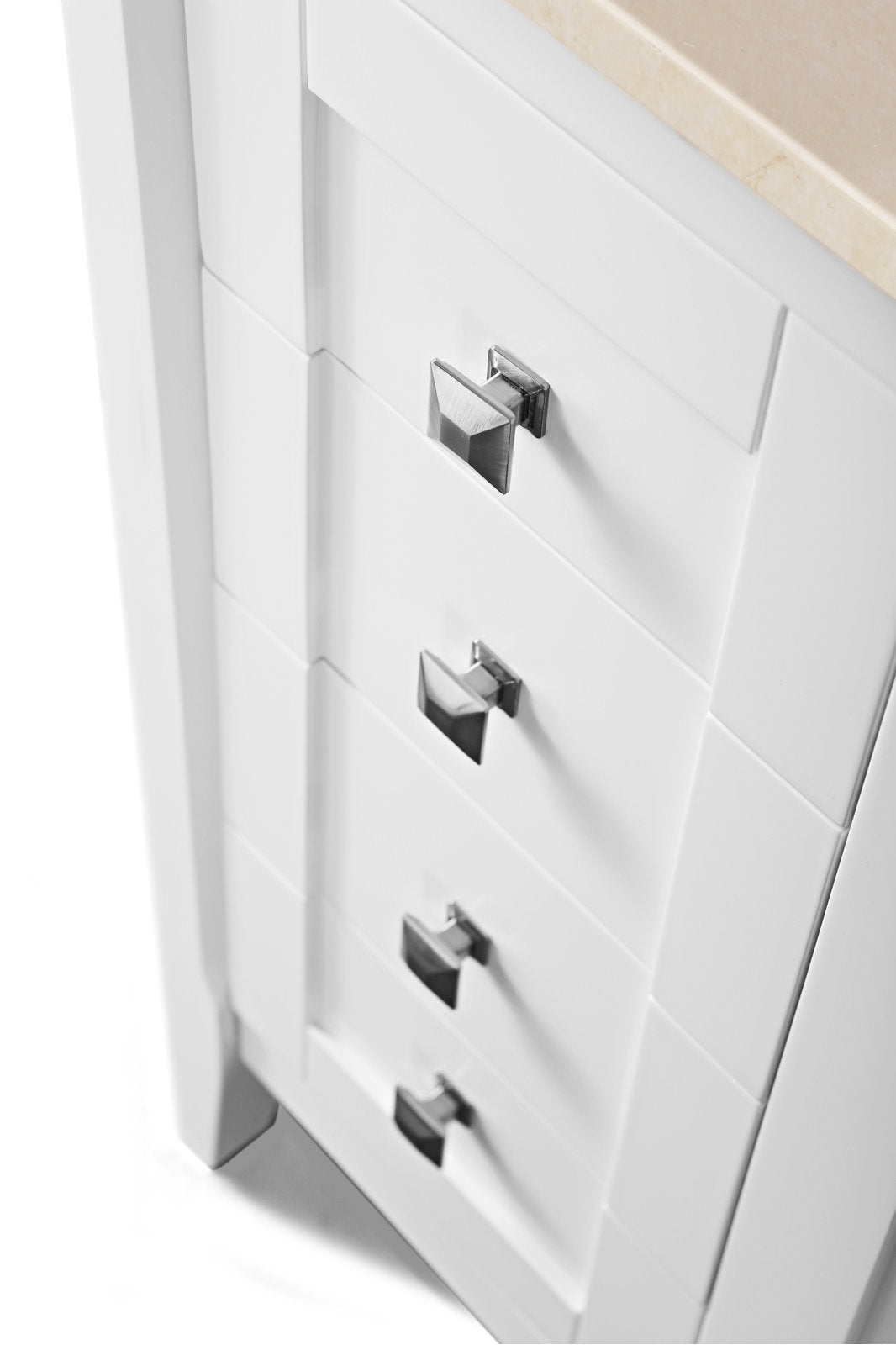Close-up of a white solid wood bathroom vanity drawer column with a beige stone top edge, modern square chrome knobs and recessed panel detailing.