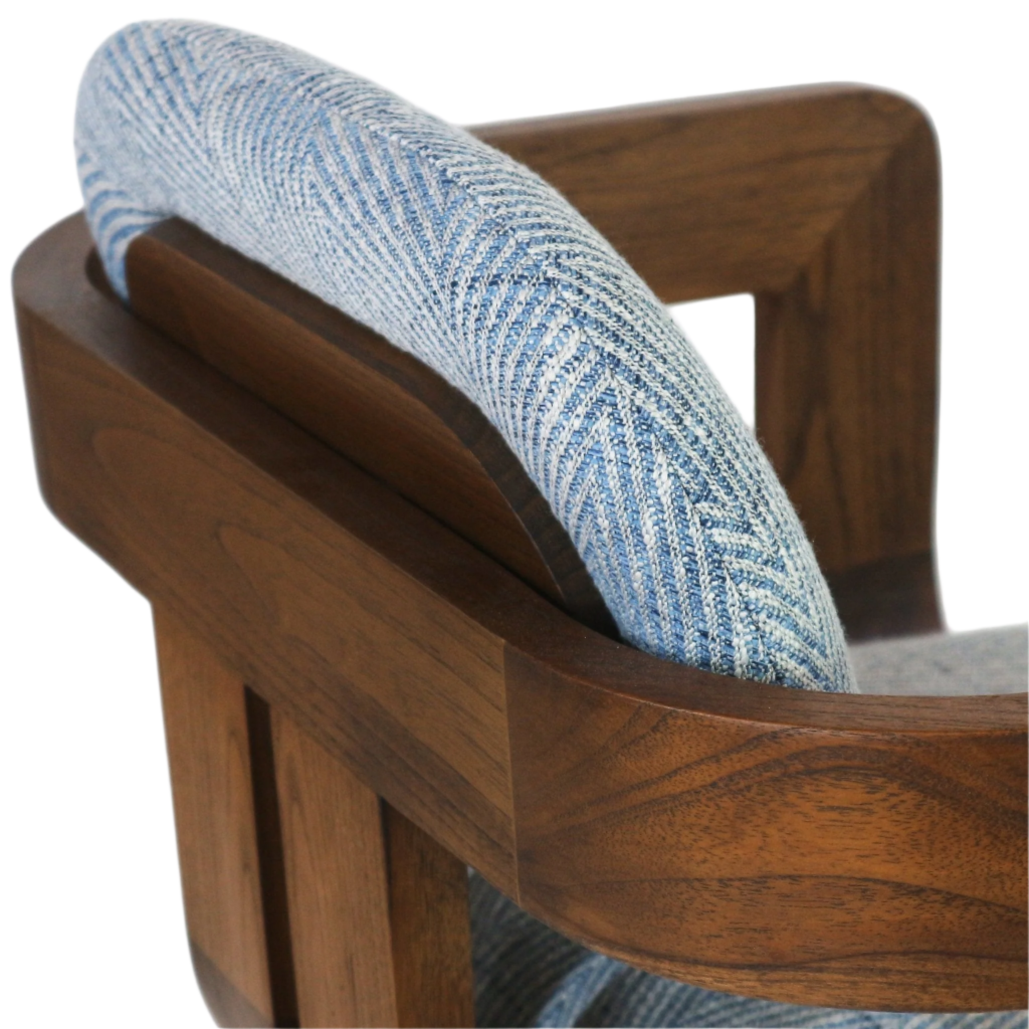 Close-up of a bar stool showing a curved blue herringbone upholstered back nestled into a warm walnut wood frame with visible grain and slat arm detail.