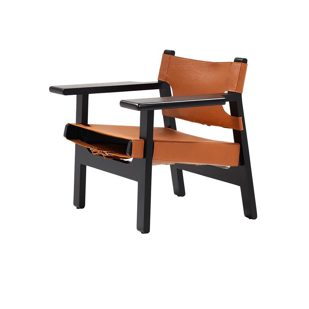 Modern lounge chair with tan leather sling seat and back suspended on a black solid wood frame with wide flat armrests.