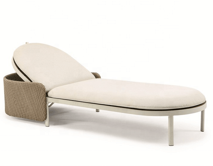 Low-profile coastal sun lounger with natural beige fabric cushions, curved woven rope side-back and slim light metal tubular legs and frame.