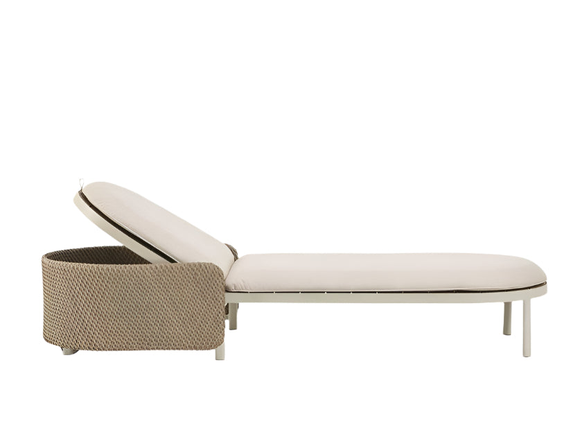 Profile view of a coastal-style sun lounger with beige fabric cushions, natural woven rope frame and slim cream metal legs, featuring an adjustable backrest.