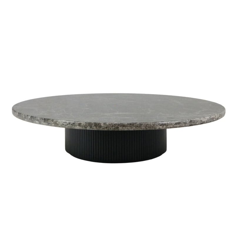 Low round coffee table featuring a gray marble top and a black fluted wooden cylindrical base in a minimalist modern style for living rooms.