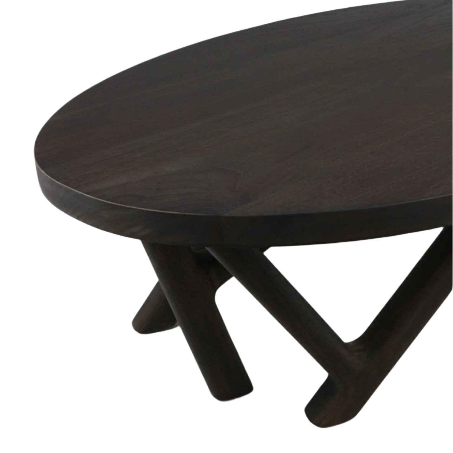Close-up of a round solid-wood mahogany coffee table top in a smoked-black finish, showing intersecting angled legs and the table edge in a modern contemporary style.