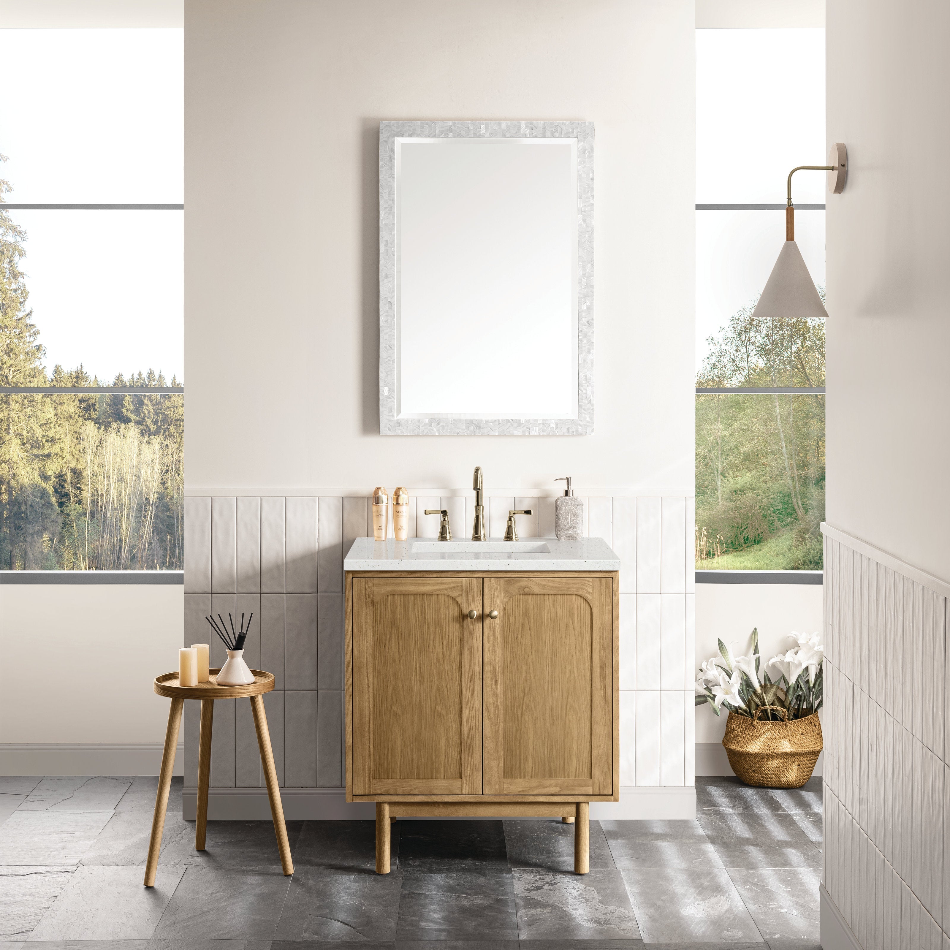 30-inch single-sink bathroom vanity in natural solid wood with a stone countertop, rectangular undermount sink and brass widespread faucet; freestanding two-door cabinet on legs shown with mirror and decor.