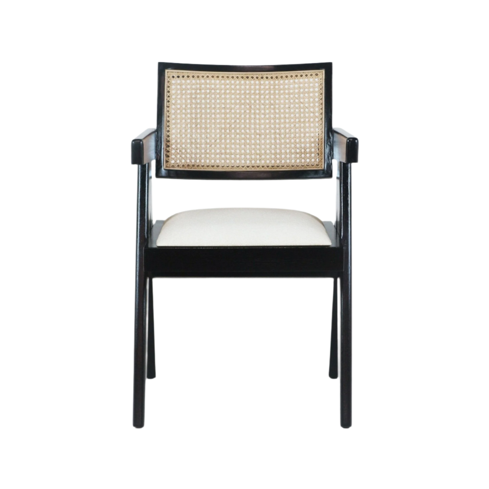 Front view of a mid-century modern dining chair with a black wood frame, woven natural cane back, slim arms, and a beige upholstered seat cushion.
