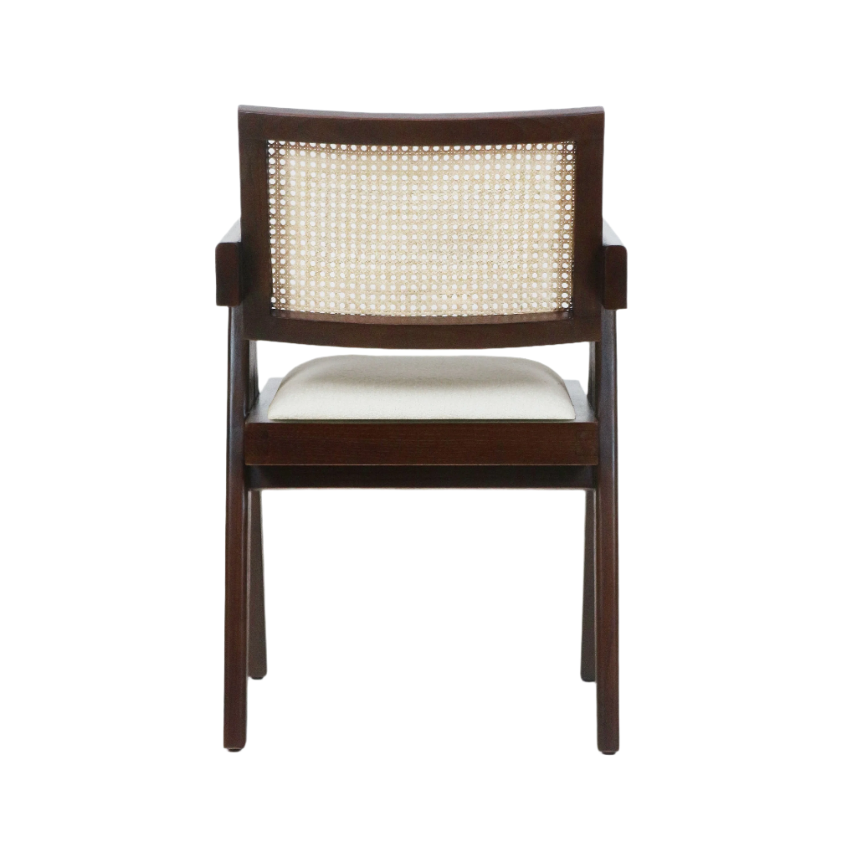 Back view of a mid-century modern dark wood dining chair featuring a woven cane back, slim wooden arms and a beige upholstered seat cushion.
