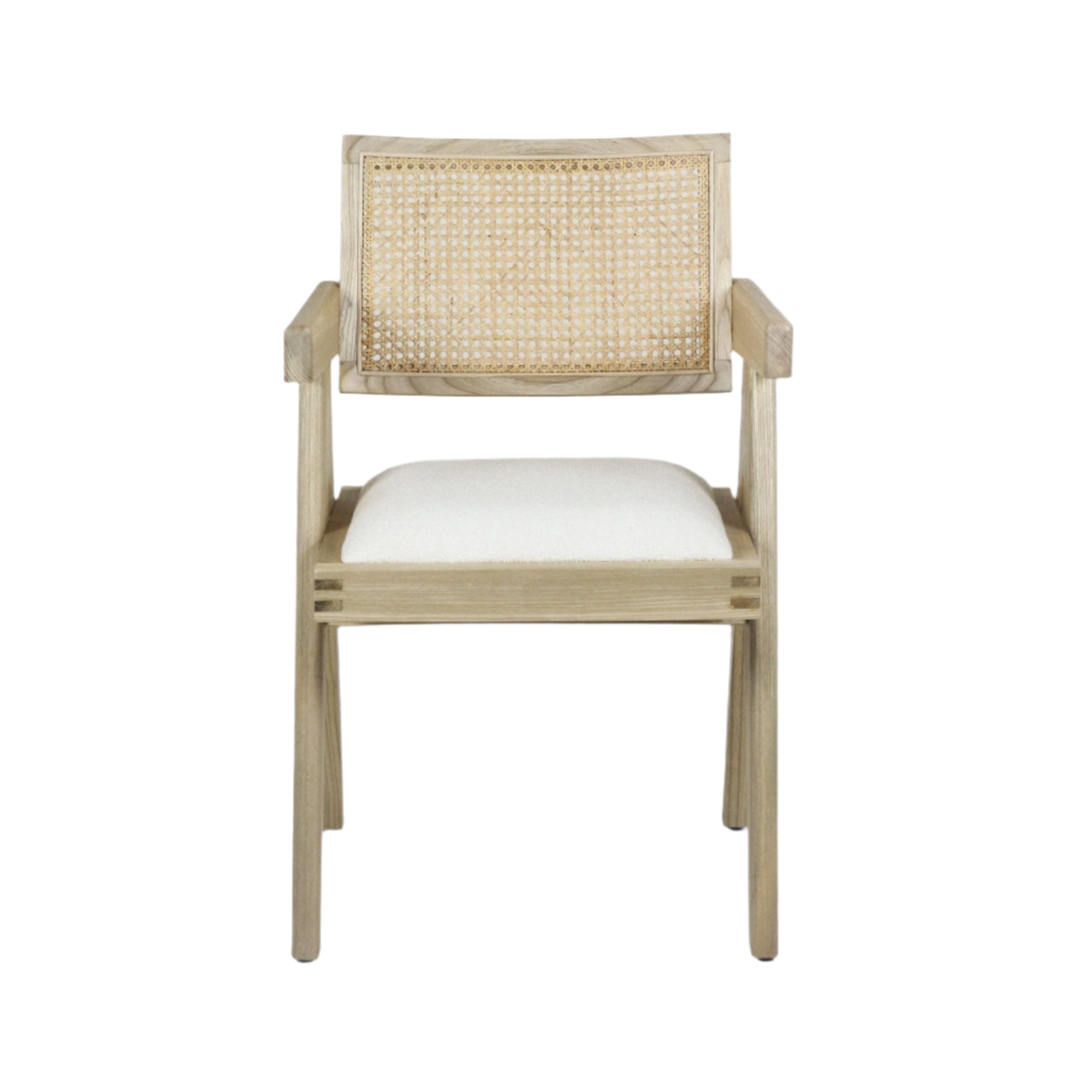 Front view of a natural blonde wood dining chair with a woven cane back, straight armrests and an off-white upholstered seat cushion in a mid-century modern style.