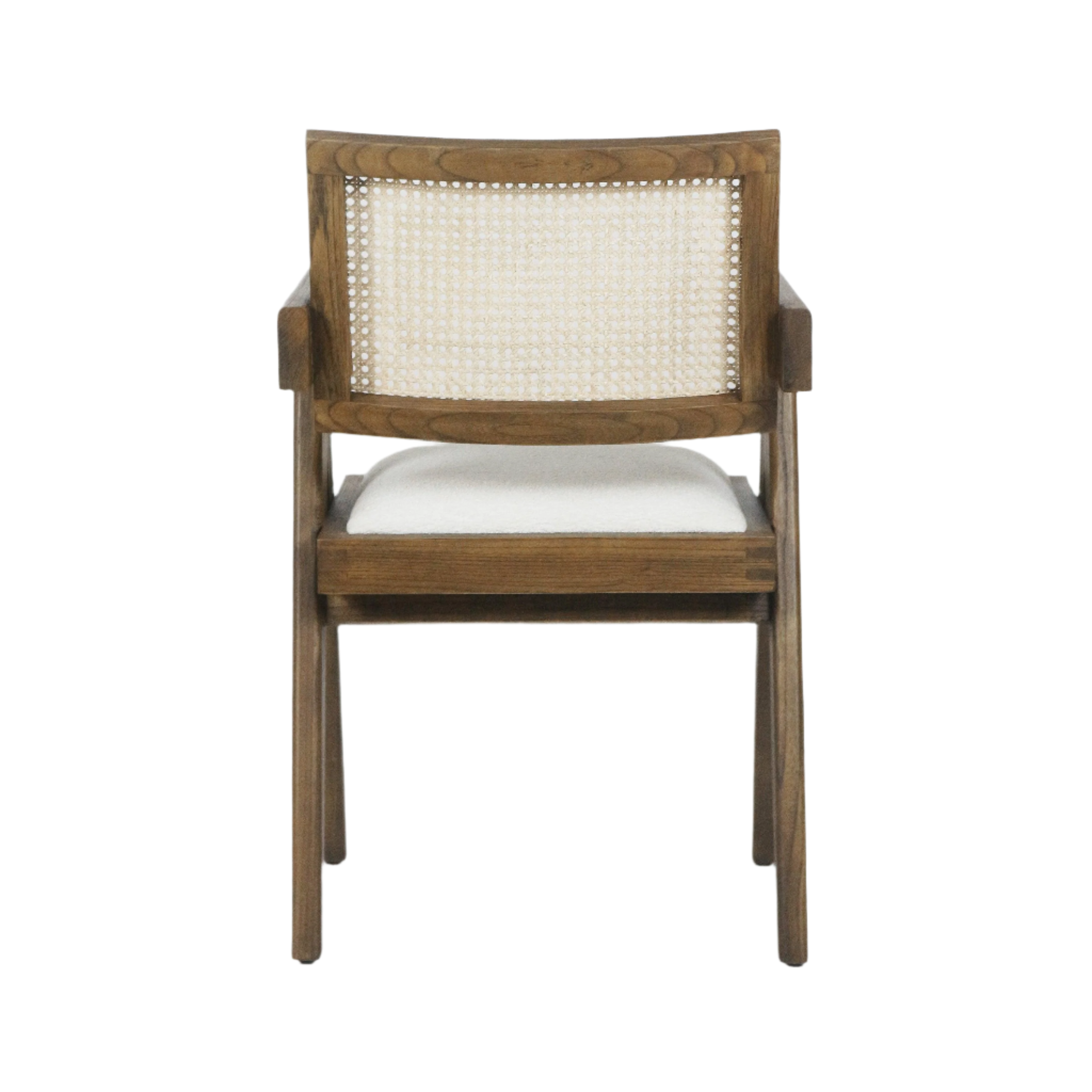 Rear view of a mid-century modern natural wood dining chair featuring a woven cane back, short wooden arms and a cream upholstered seat cushion.