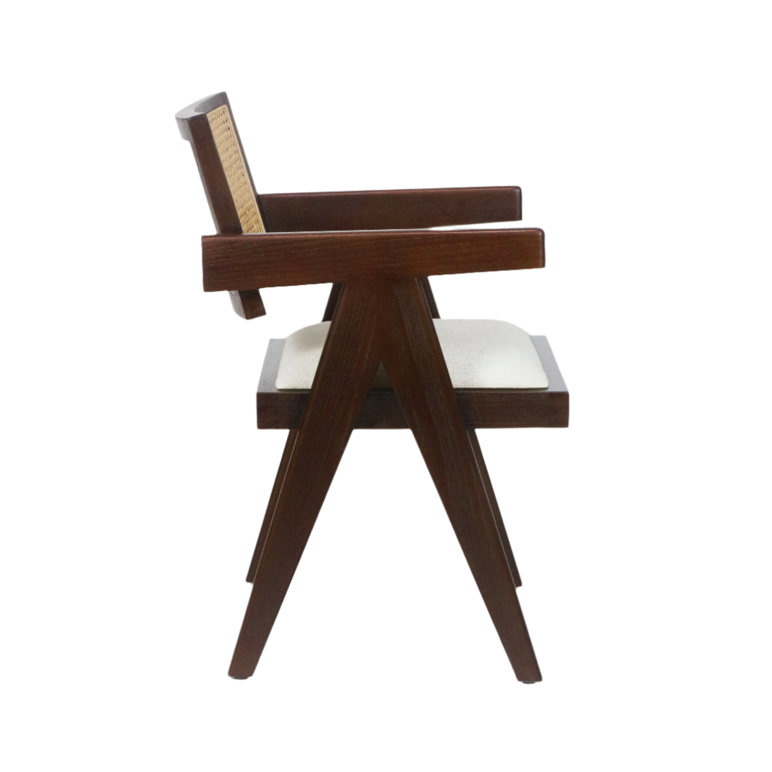 Side view of a mid-century modern walnut wood dining chair with cane woven backrest, angled A-frame legs, solid wood armrests and a beige upholstered seat cushion against a white background.