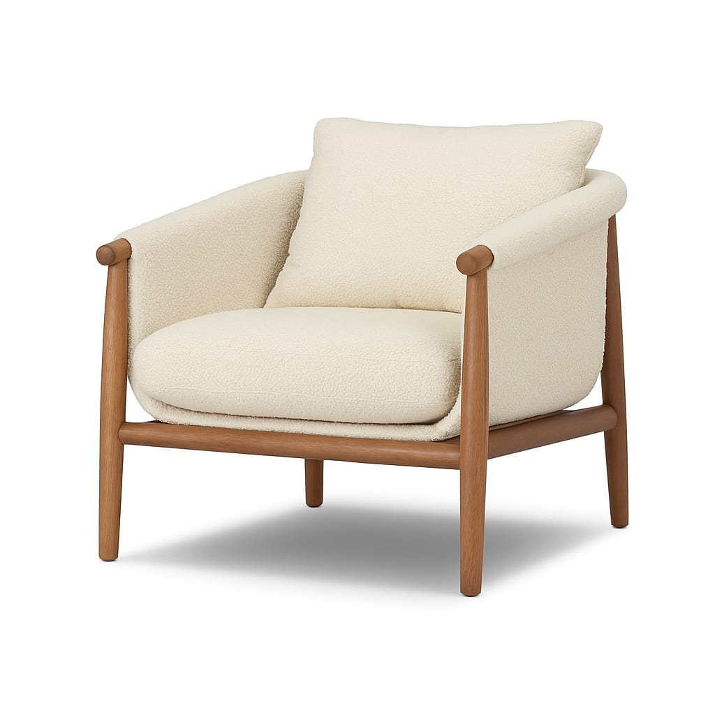 Cream boucle accent chair with plush seat and loose back cushion, rounded padded arms and exposed natural wood frame with tapered legs, shown against a white background.