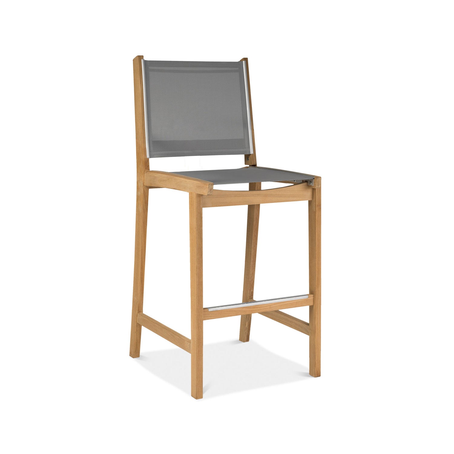 Armless outdoor bar stool with a natural teak frame, gray mesh seat and back, and a silver metal footrest in a coastal-modern design, shown on a white background.