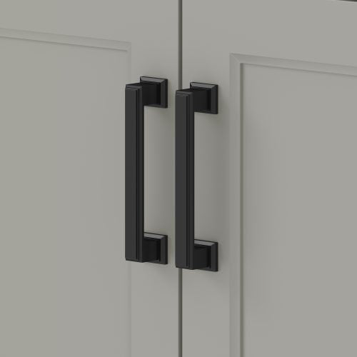 Close-up of matte black rectangular bar pulls mounted on adjacent light-gray painted wooden cabinet doors of a modern single-sink bathroom vanity.