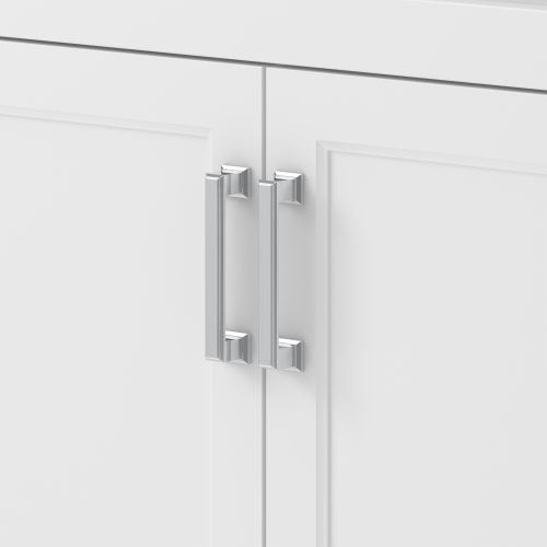 Close-up of chrome rectangular bar handles mounted on two shaker-style cabinet doors of a stone-colored solid wood bathroom vanity, showing vertical pulls with square mounting posts.