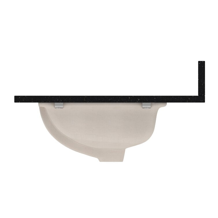 Side profile of a black quartz vanity top showing a beige ceramic undermount sink beneath and a short vertical backsplash at the right edge.