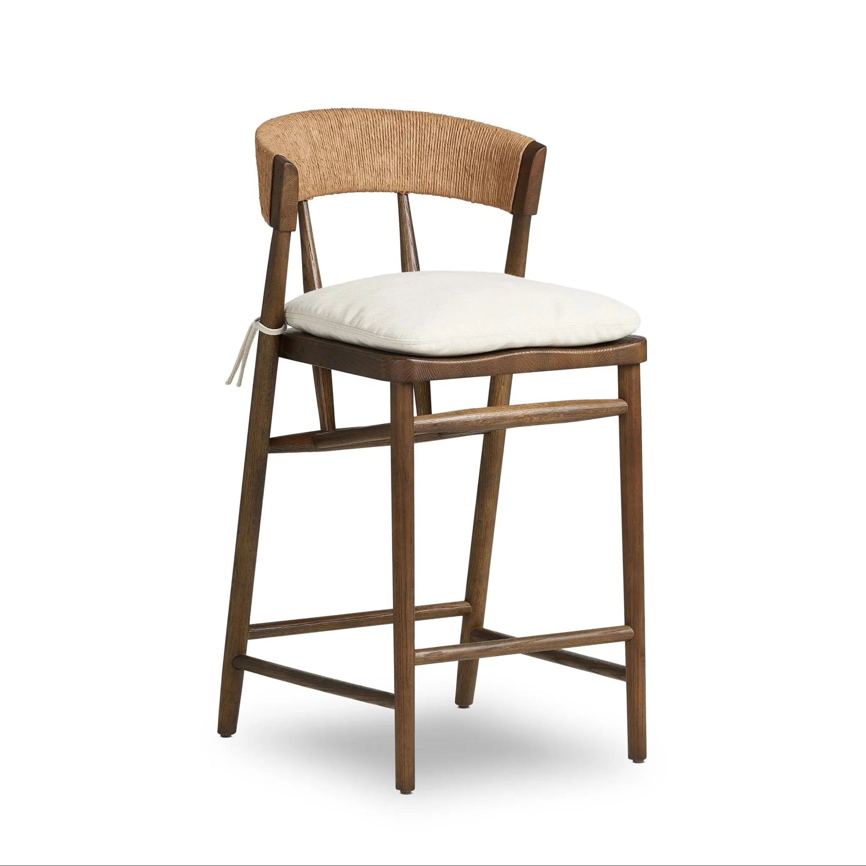 Counter-height wooden stool with a natural wood frame, rope-wrapped C-shaped back and a tied cream fabric cushion on the seat, styled in a rustic modern farmhouse design.