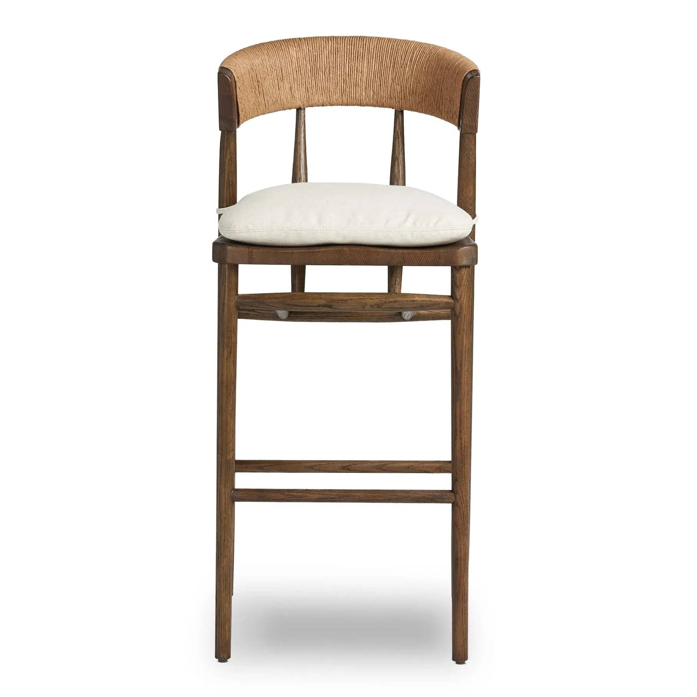 Front view of a natural wood counter stool with a woven rope C-shaped backrest and an off-white cushioned fabric seat tied to a slim rustic farmhouse-style frame.