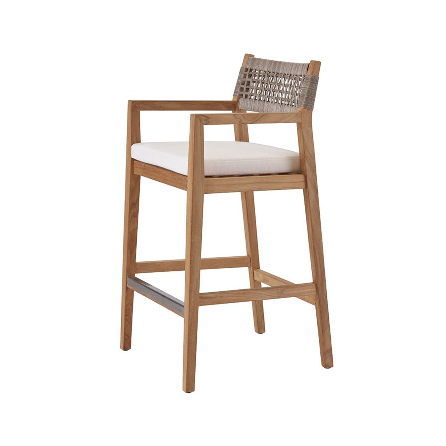 Natural teak outdoor bar stool with a solid wood frame and armrests, white upholstered seat cushion, woven rope back in neutral tones and a metal footrest.