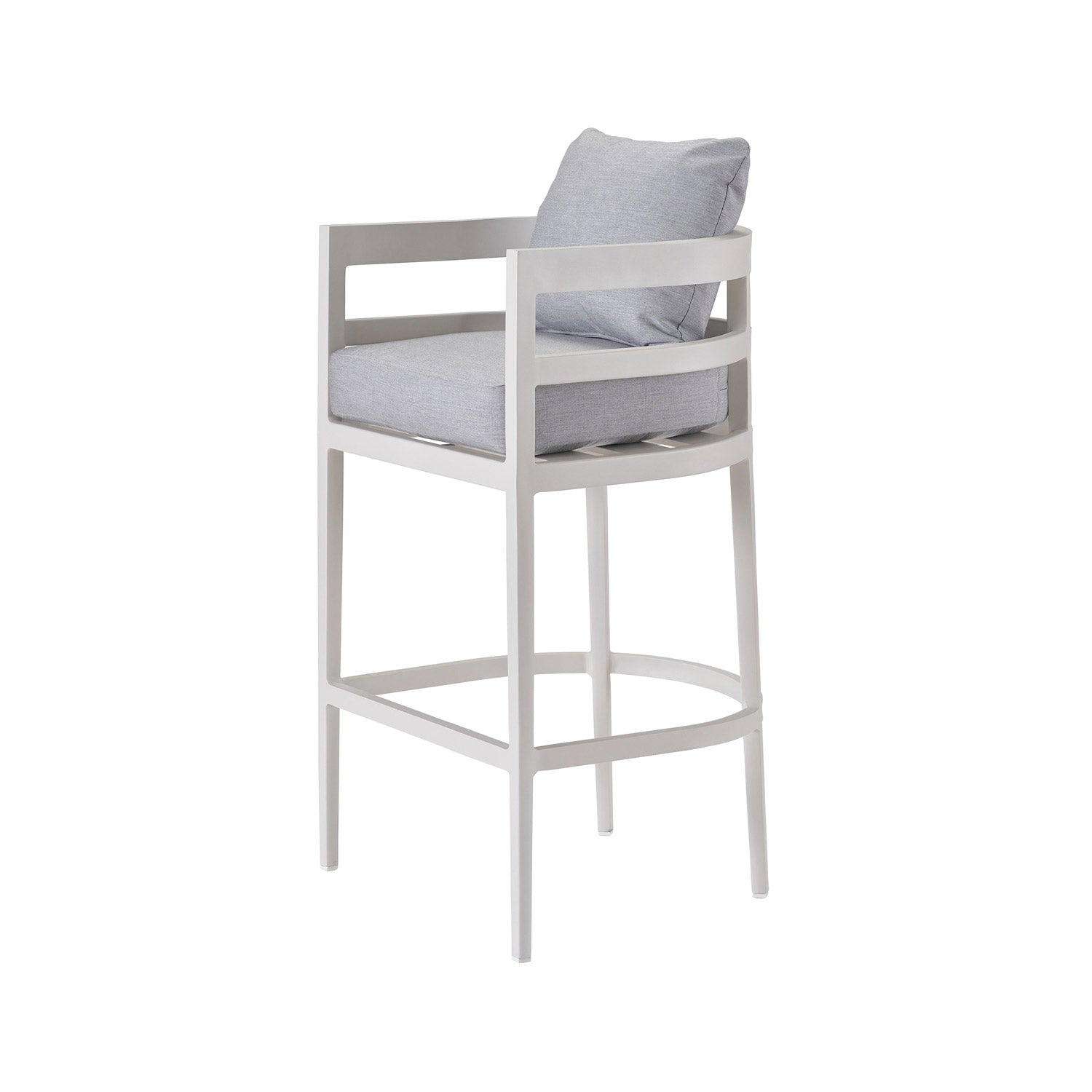 Coastal-style teak outdoor bar stool in natural finish with light gray upholstered seat and back cushions, open slatted back and arms, tall legs and integrated curved footrest.