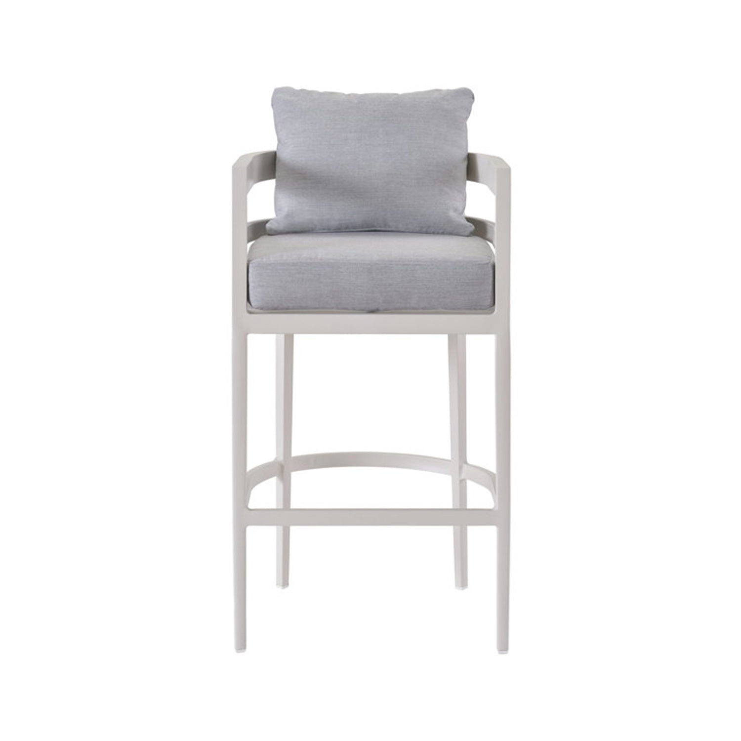 Natural teak outdoor bar stool with a light gray upholstered seat and loose back cushion, open-armed frame, slim tall legs and curved footrest in a coastal style.