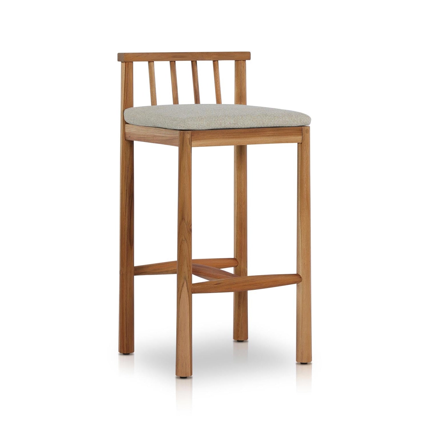 Armless outdoor bar stool with a solid teak frame, low slatted back and light-gray upholstered seat cushion; four straight legs joined by crossed footrests for coastal-contemporary outdoor seating.