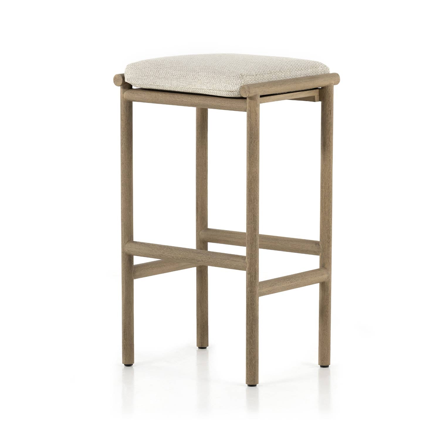 Backless outdoor bar stool with a light teak frame and round legs, featuring a beige upholstered seat cushion and cross stretchers for support.